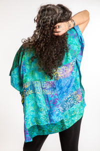 Susan is wearing the S/M Blue patchwork batik top in Turquoise
