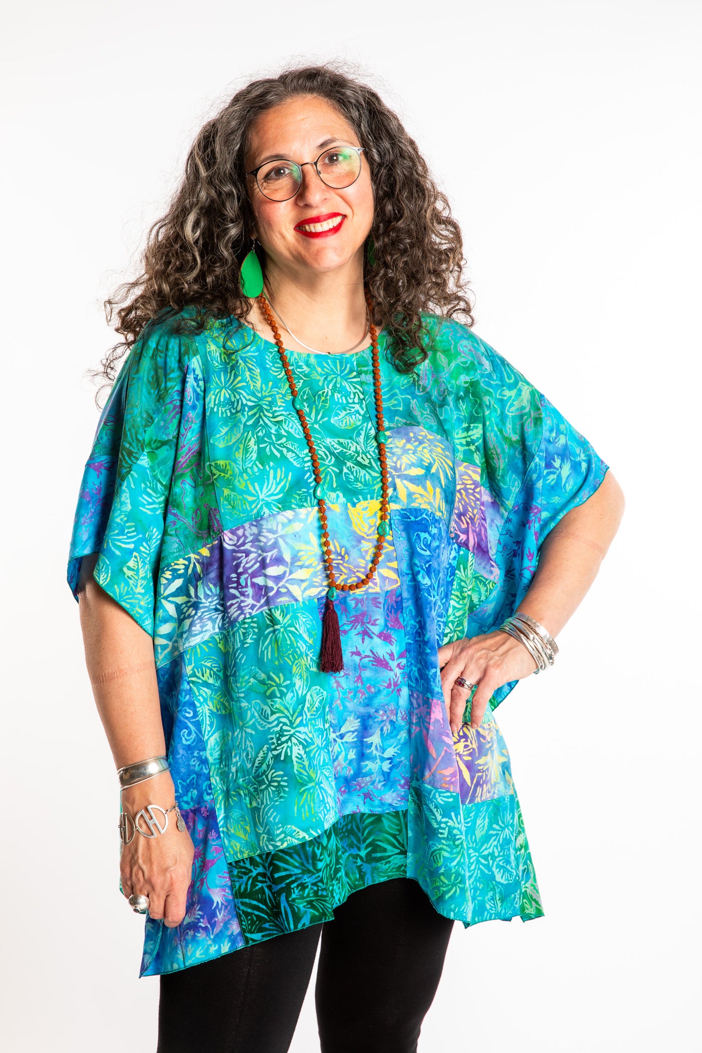 Susan is wearing the S/M Blue patchwork batik top in Turquoise