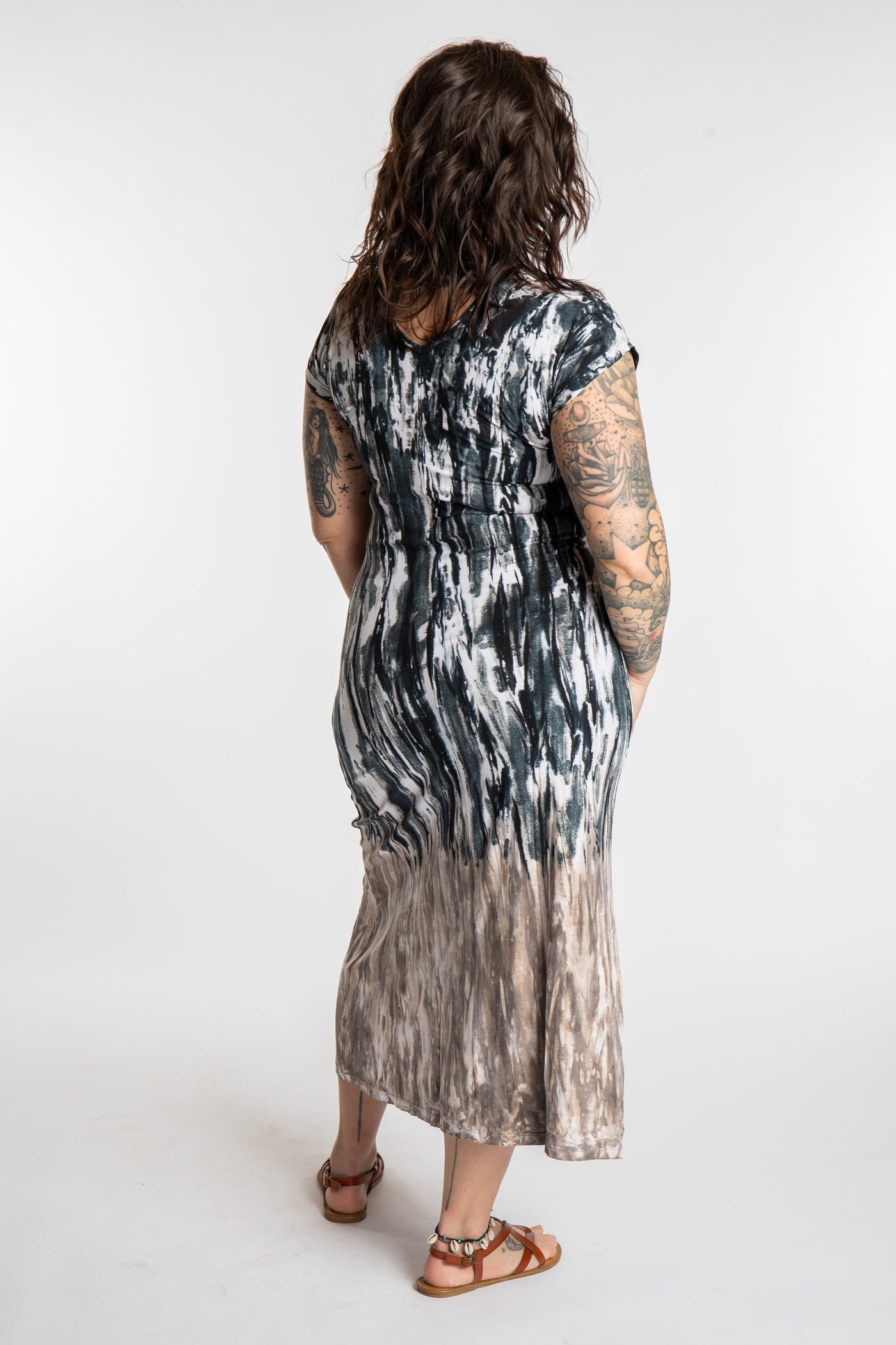 Morgan is wearing the black Tara Tie Dye Maxi Dress in size M