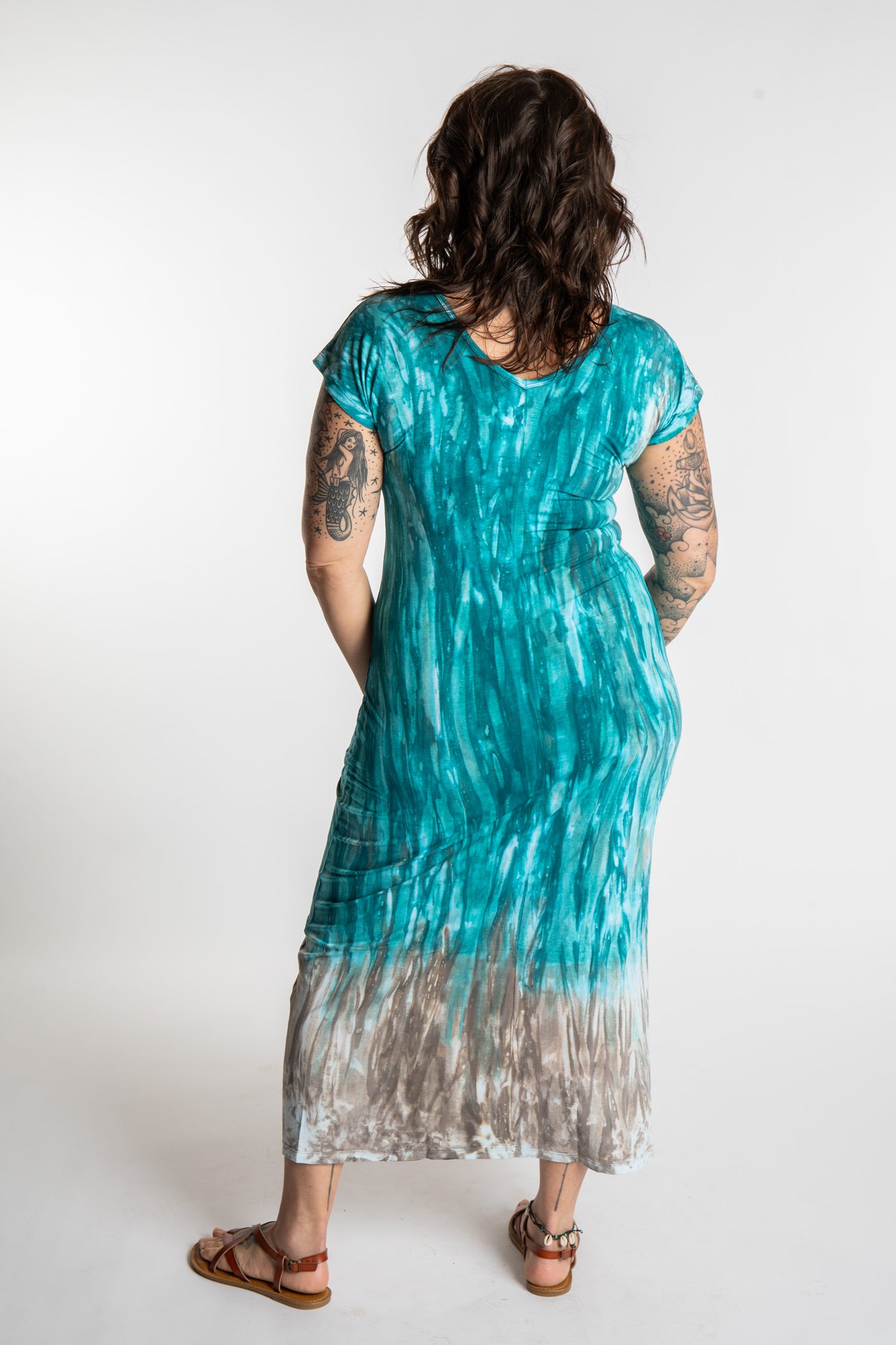 Morgan is wearing the Turquoise Tara Tie Dye Maxi Dress in size M
