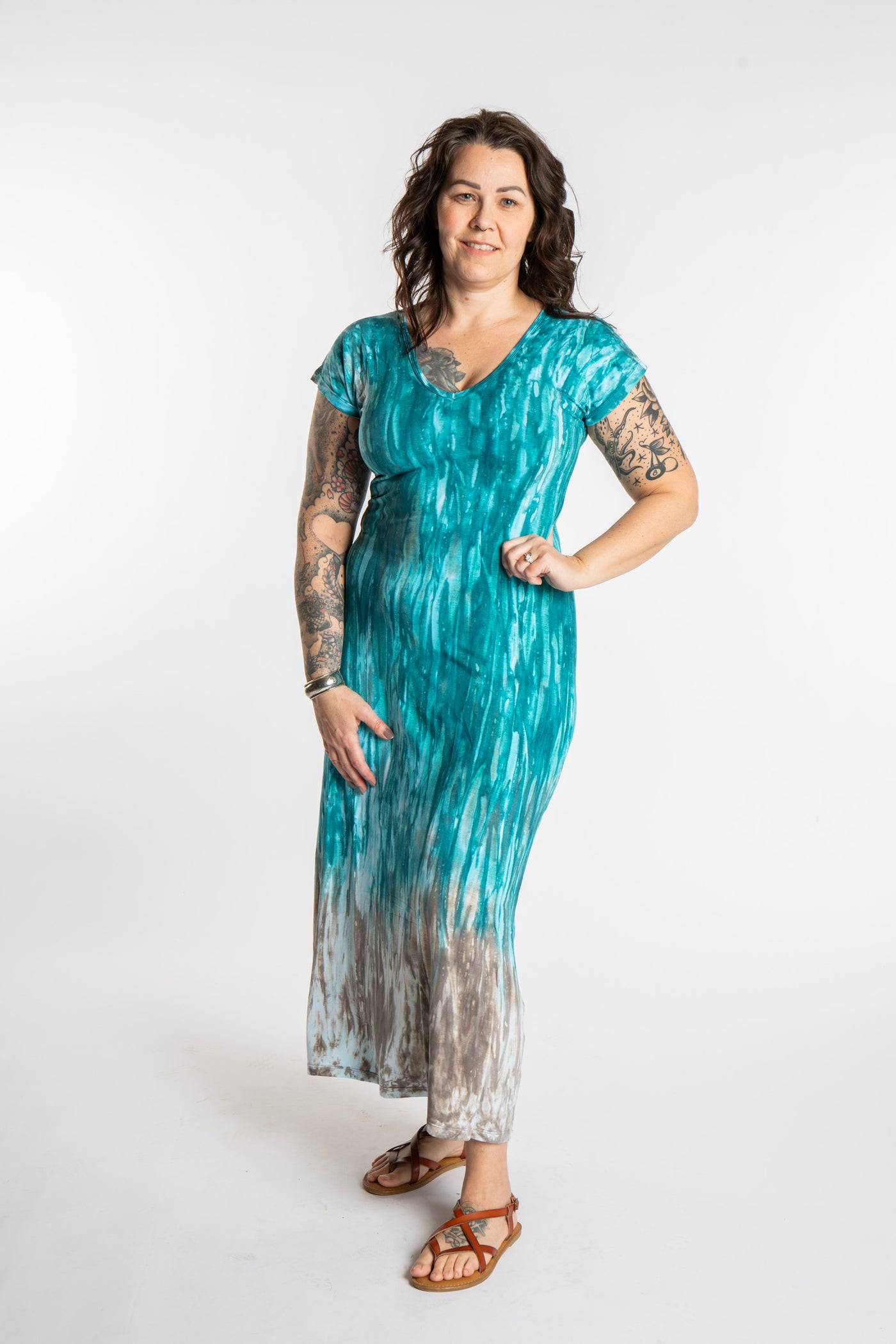 Morgan is wearing the Turquoise Tara Tie Dye Maxi Dress in size M