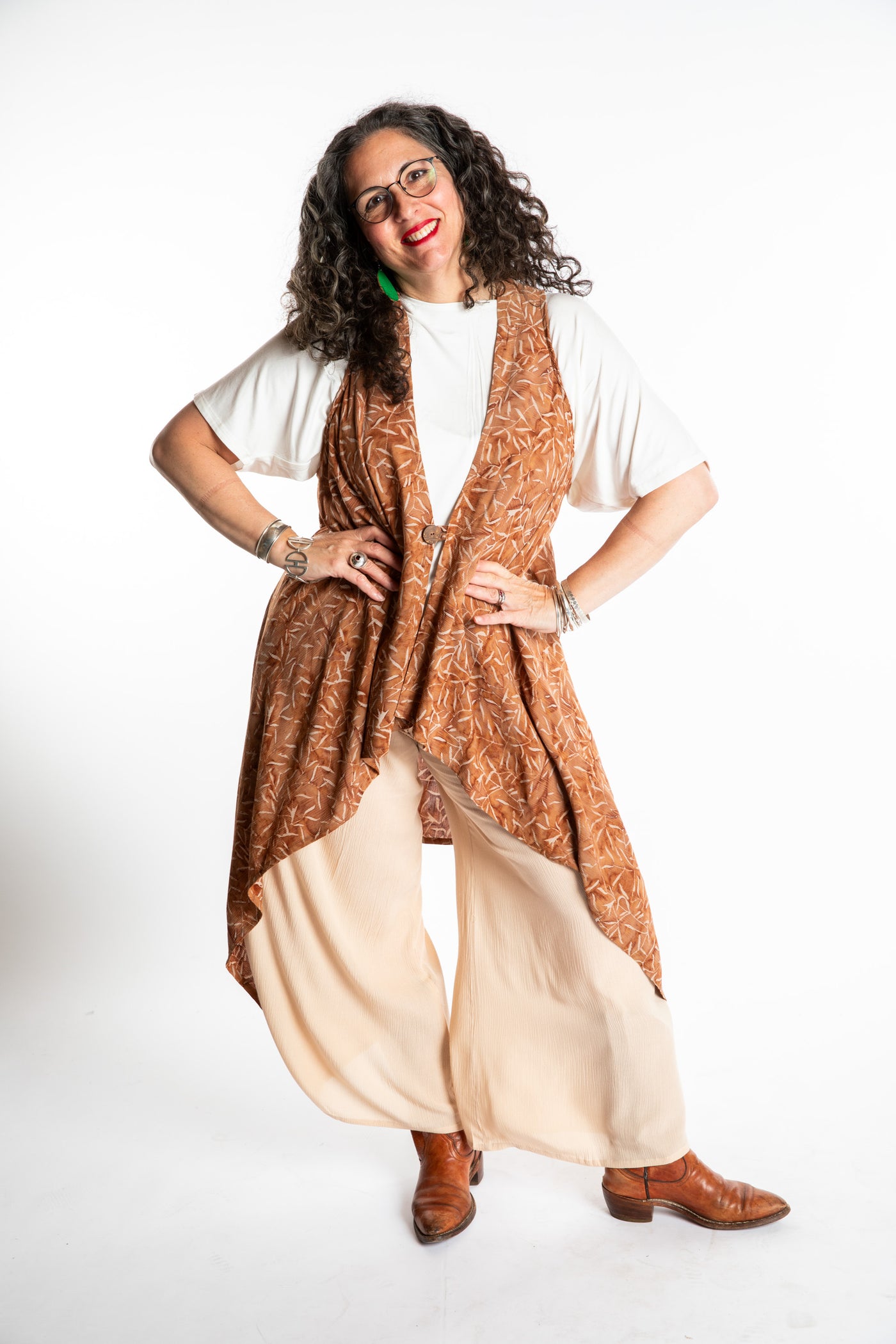 Susan wearing a long batik patterned vest in Brown