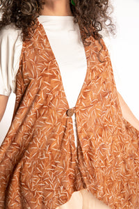 Susan wearing a long batik patterned vest in Brown