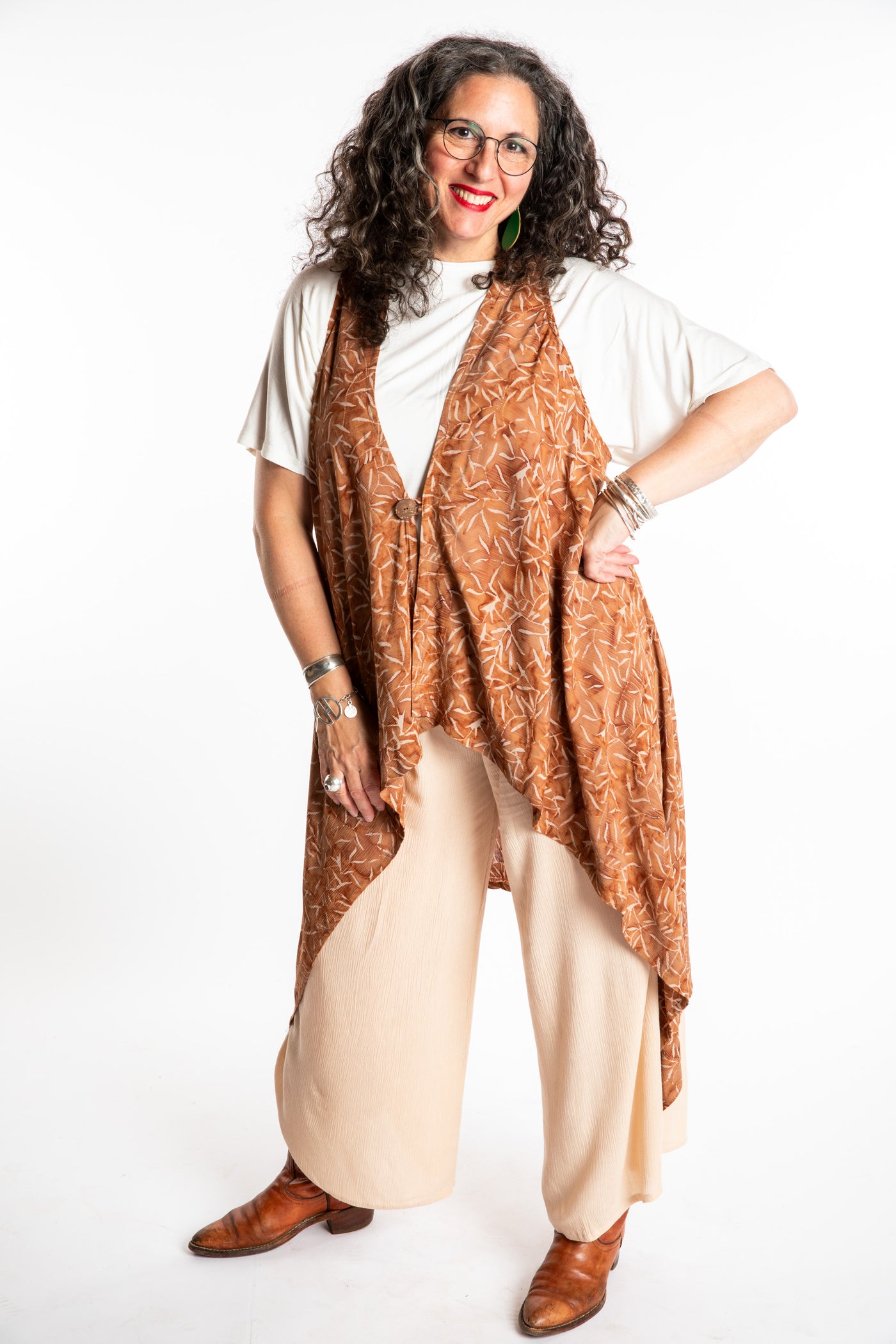 Susan wearing a long batik patterned vest in Brown