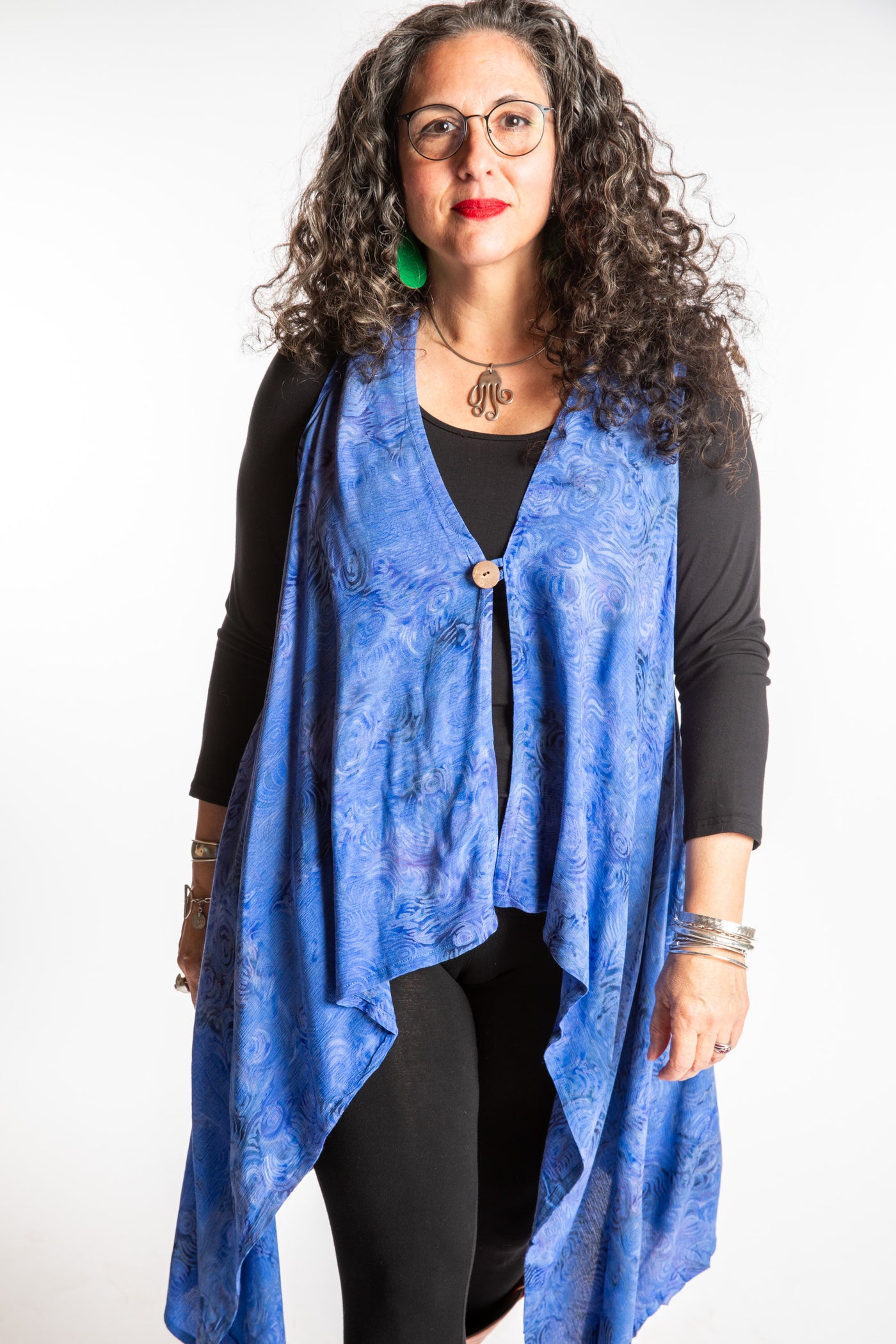 Susan wearing a long batik patterned vest in Deep Blue