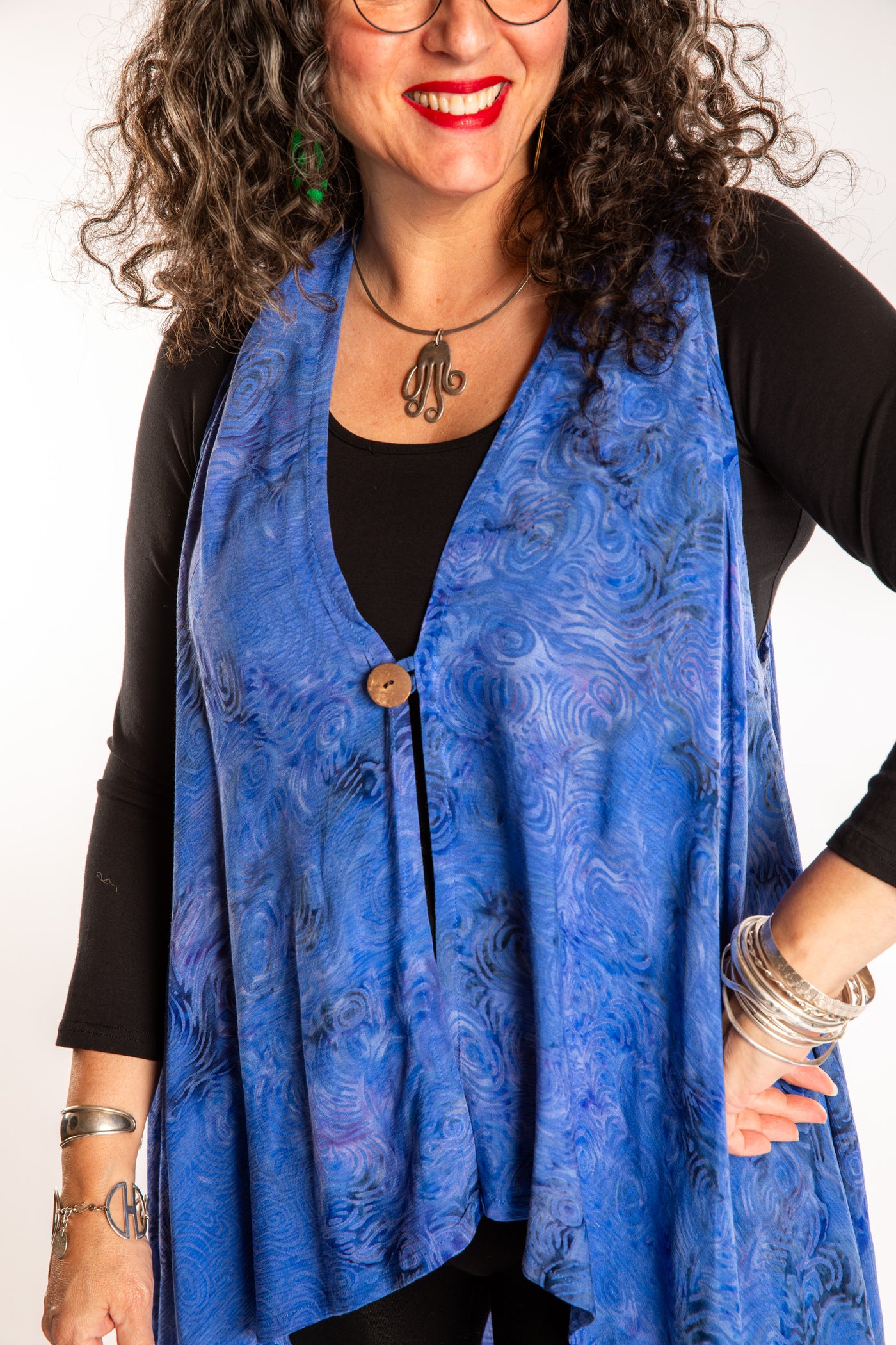 Susan wearing a long batik patterned vest in Deep Blue