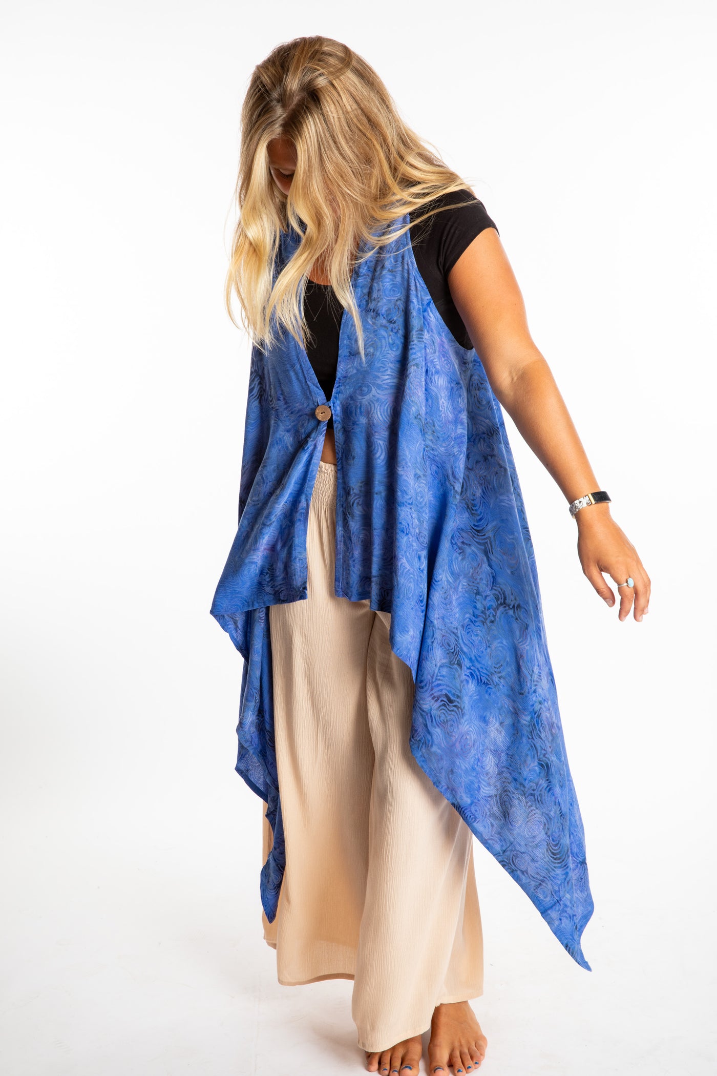 Sophie wearing a long batik patterned vest in Deep Blue