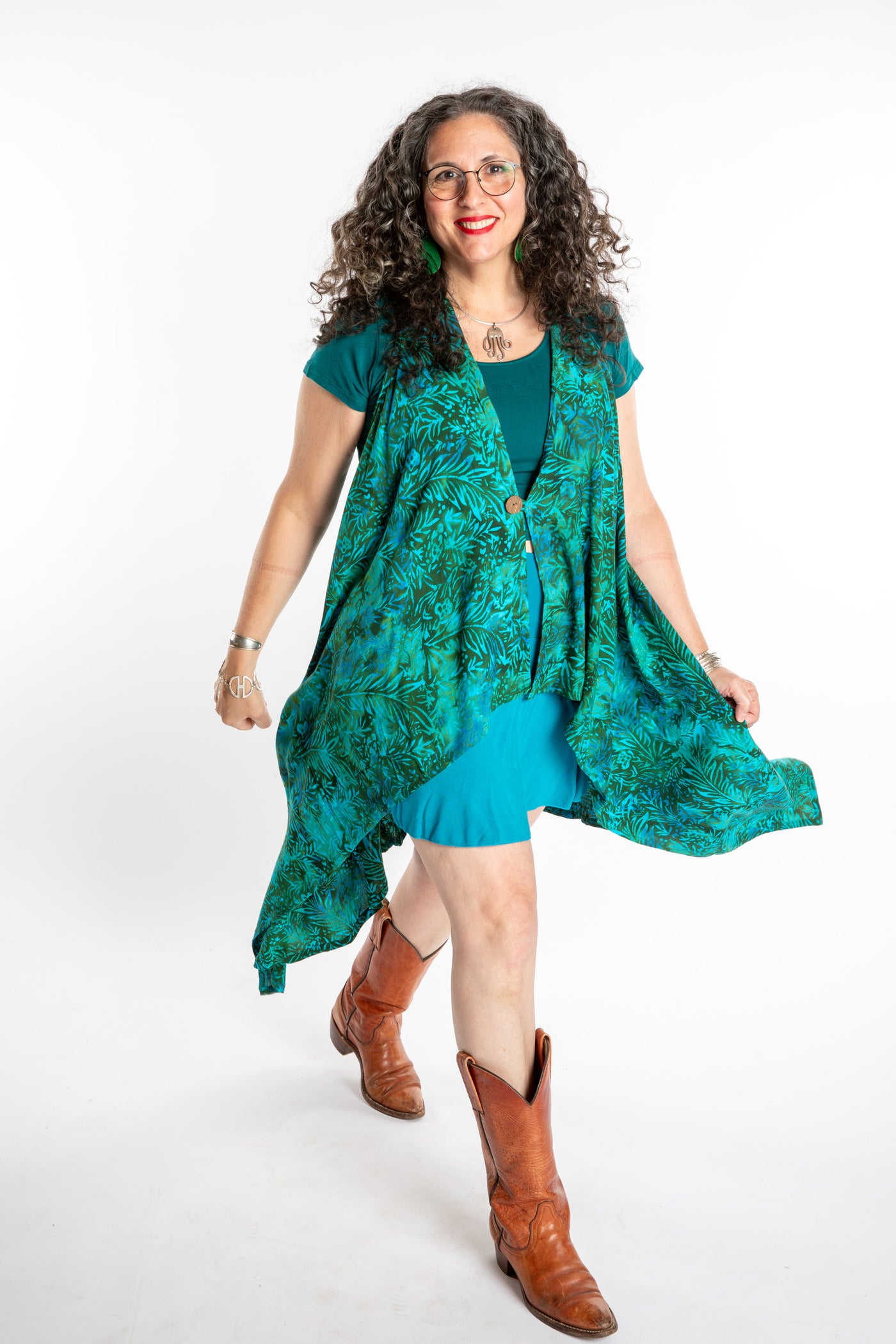 Susan wearing a long batik patterned vest in Jungle Green