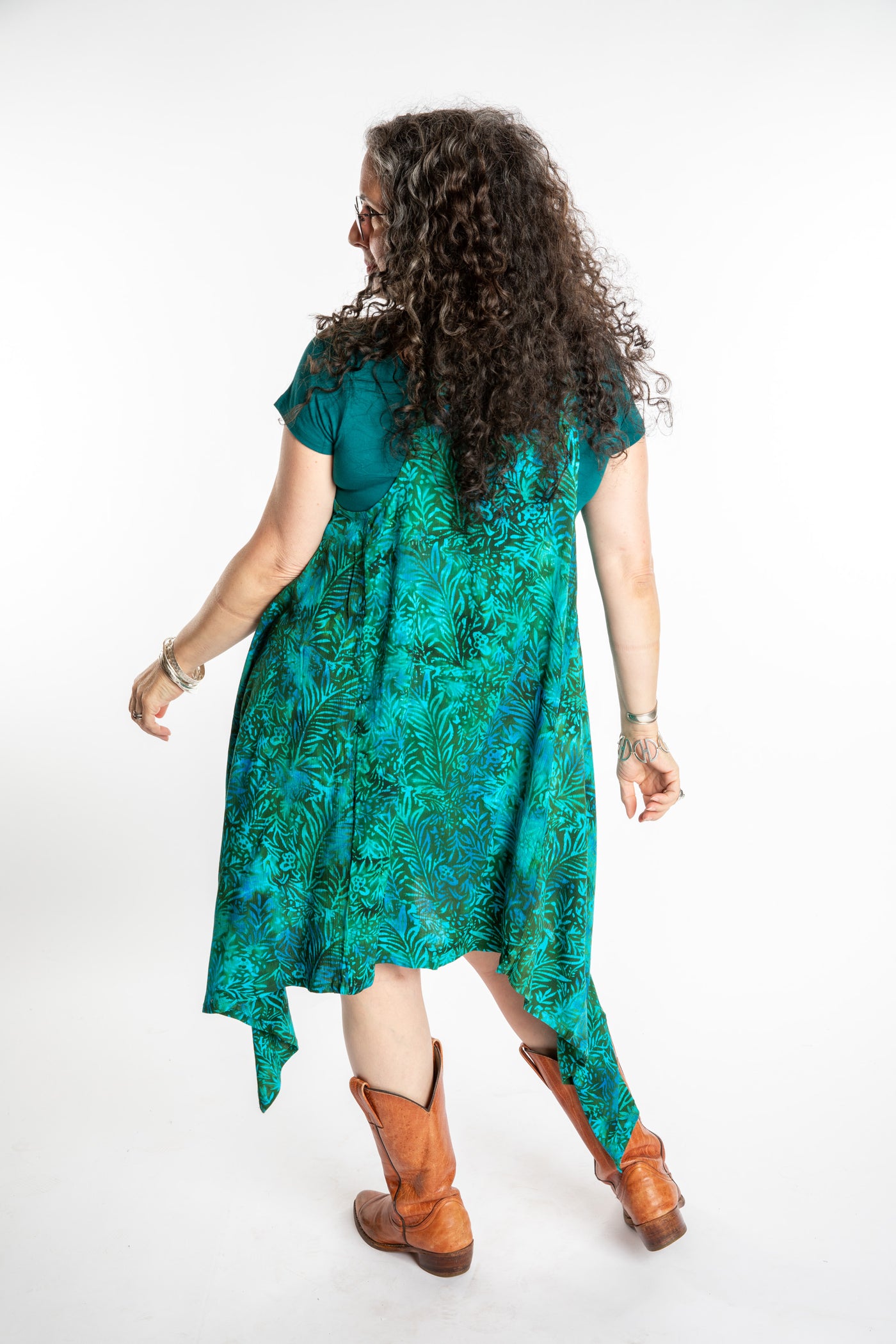 Susan wearing a long batik patterned vest in Jungle Green