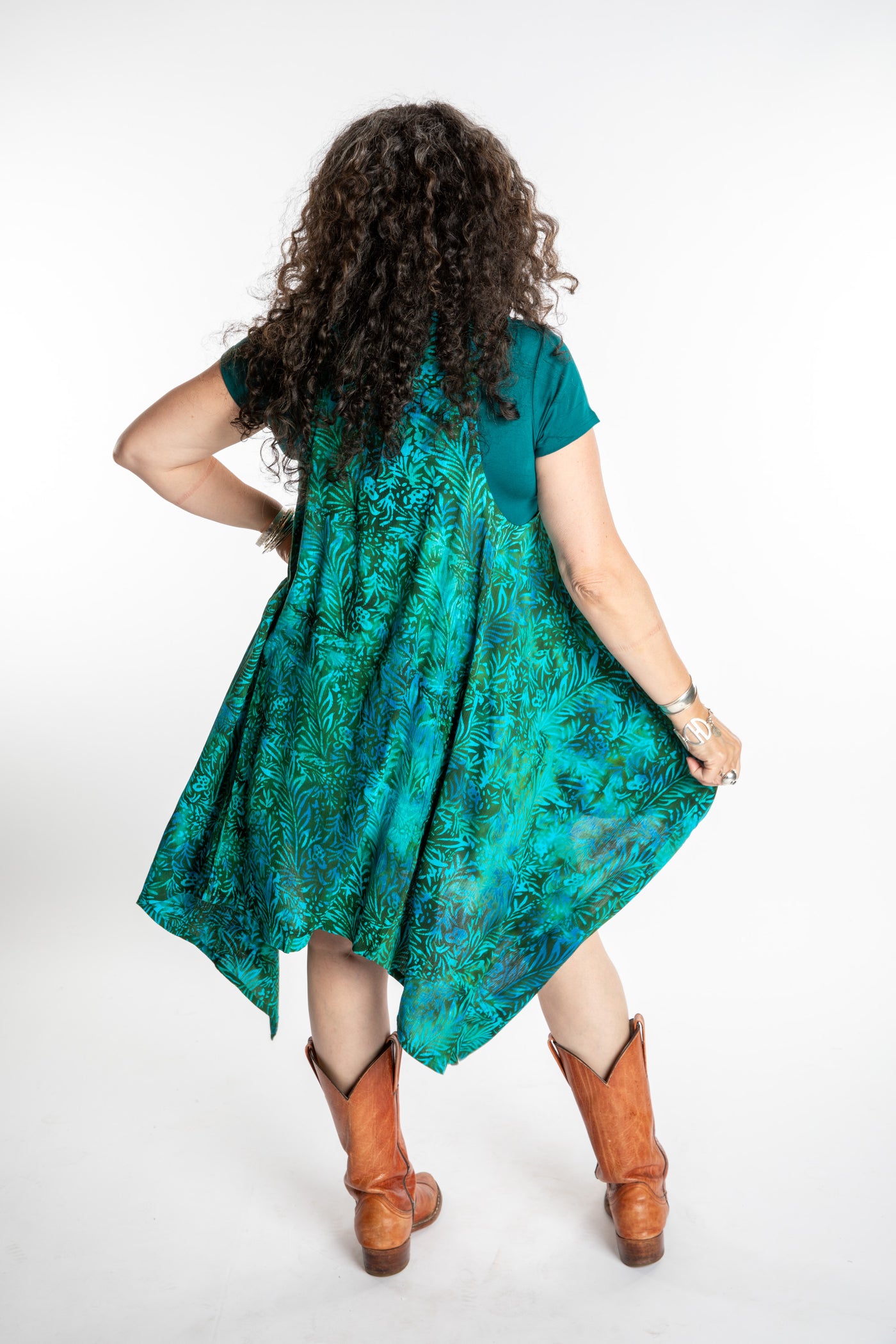 Susan wearing a long batik patterned vest in Jungle Green