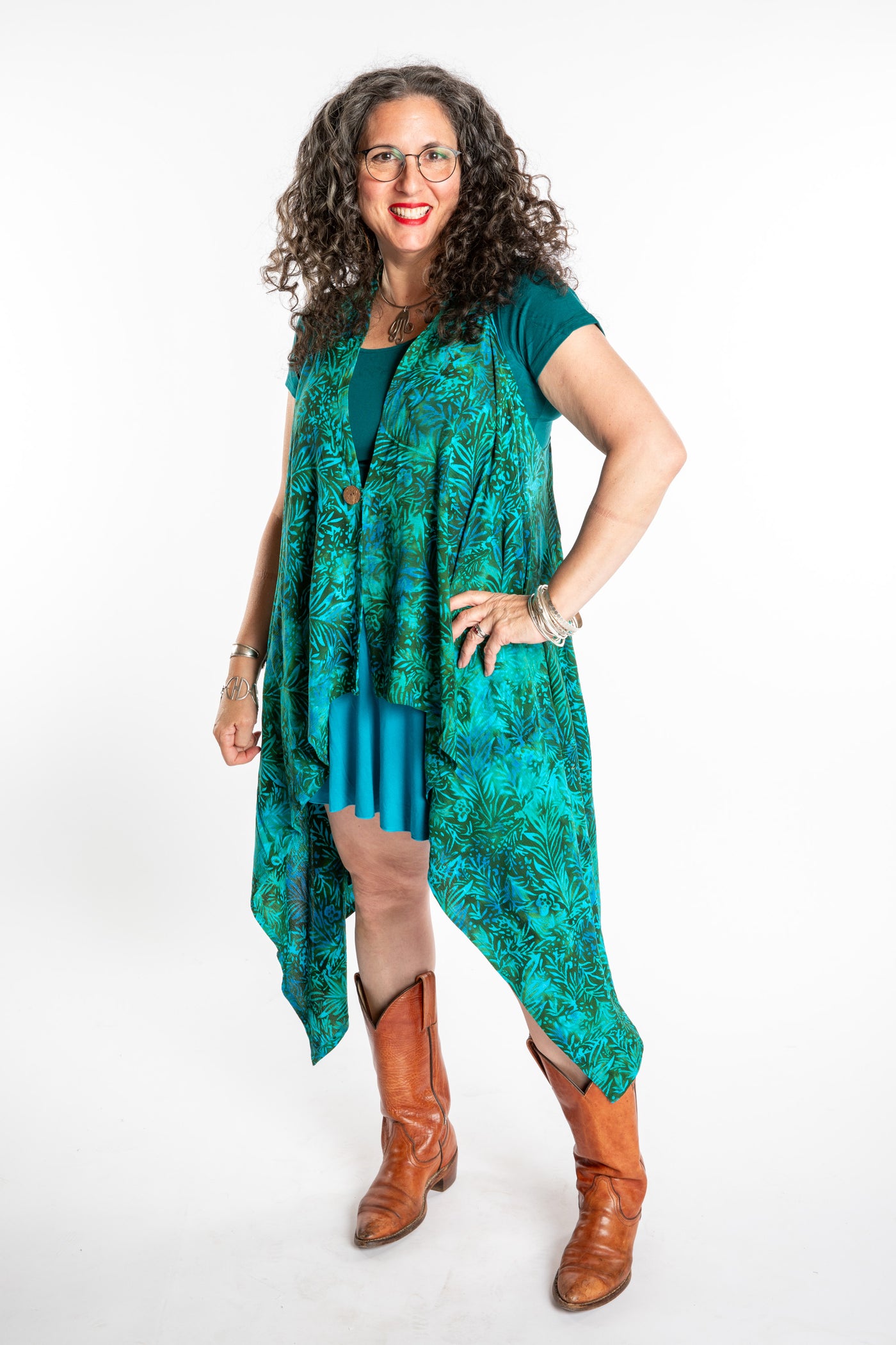 Susan wearing a long batik patterned vest in Jungle Green