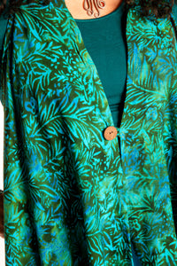 Susan wearing a long batik patterned vest in Jungle Green