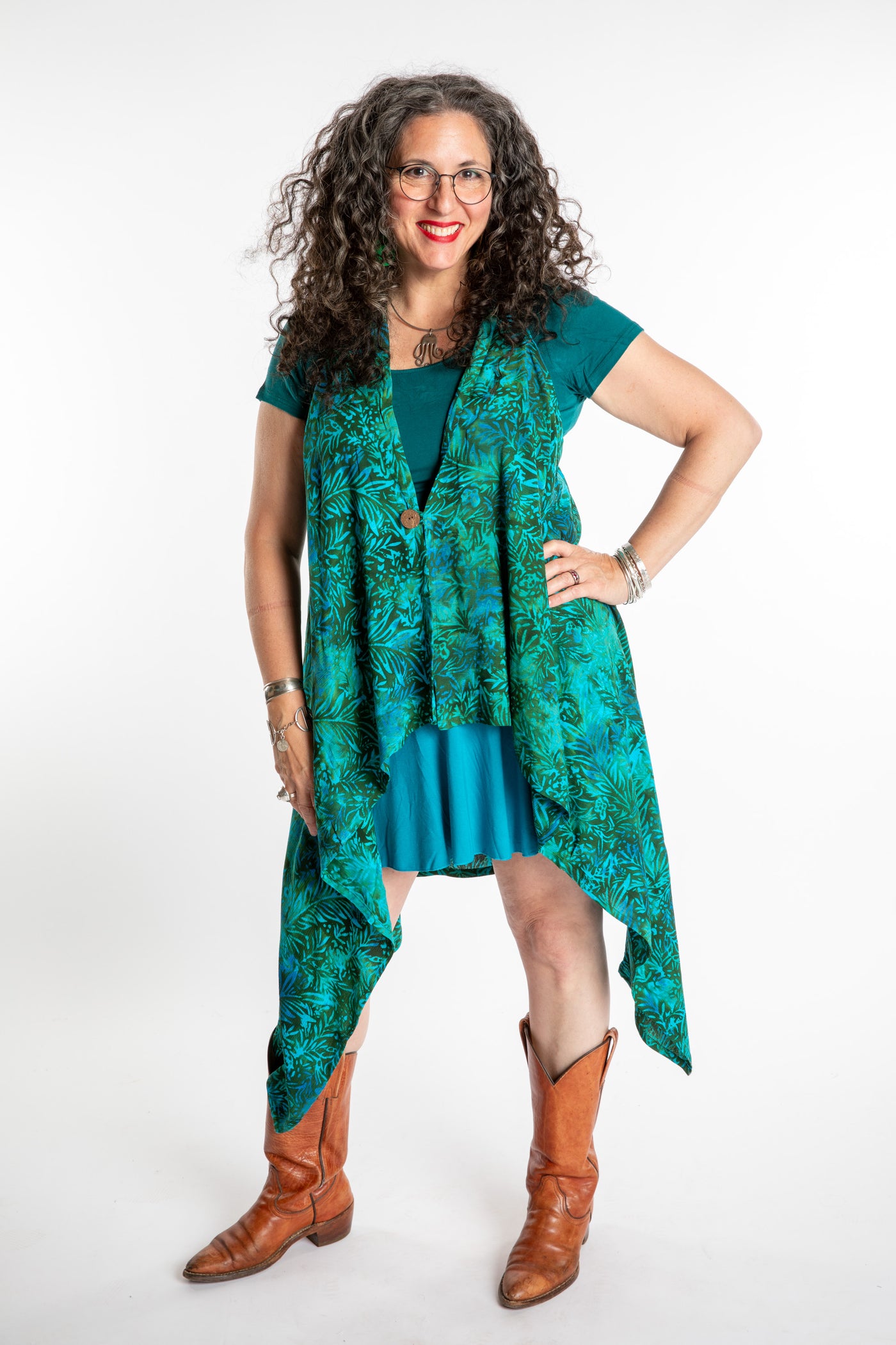 Susan wearing a long batik patterned vest in Jungle Green