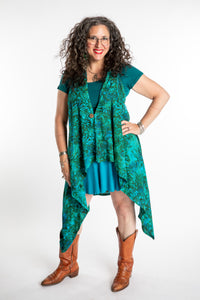 Susan wearing a long batik patterned vest in Jungle Green
