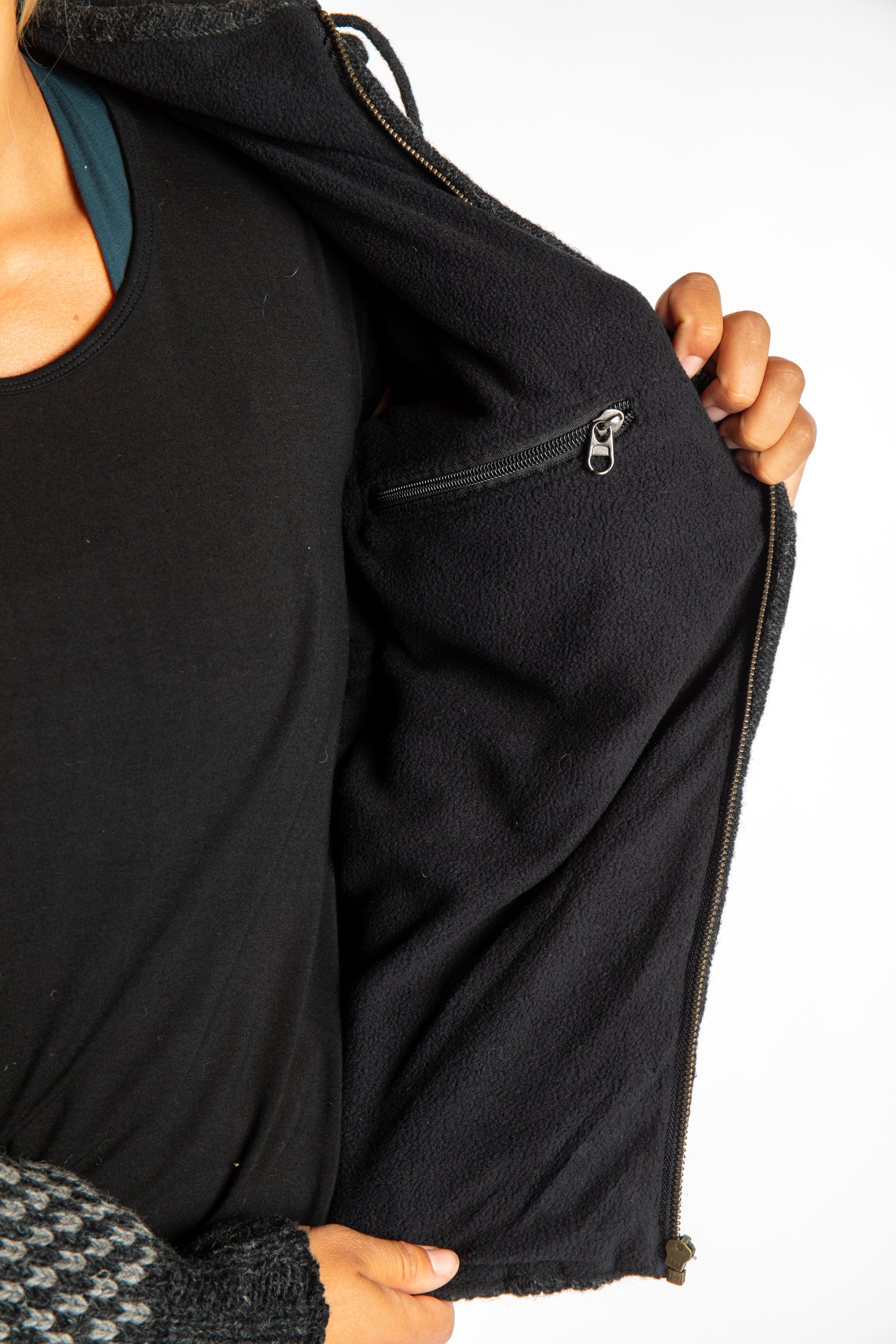 detail of stash pocket on charcoal chekered wool hoodie jacket
