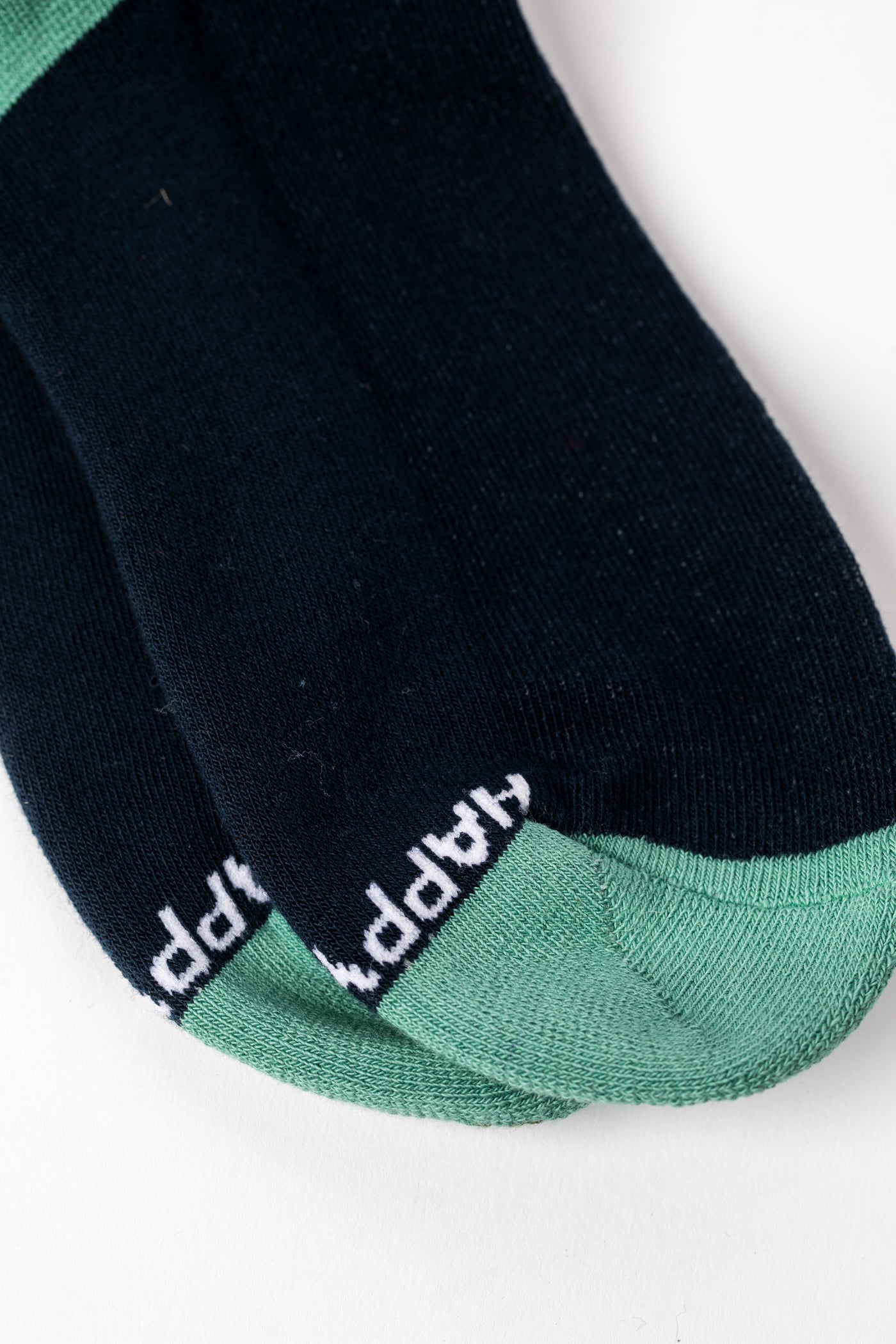 Pair of Teal socks with a forest and night sky design