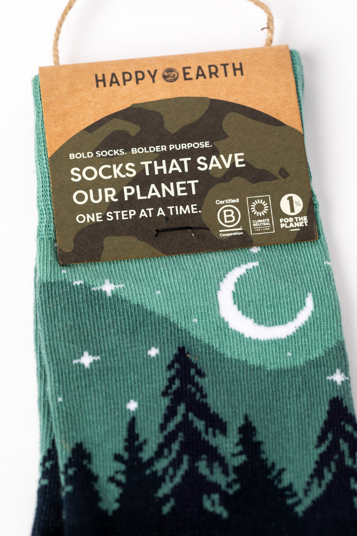 Pair of Teal socks with a forest and night sky design
