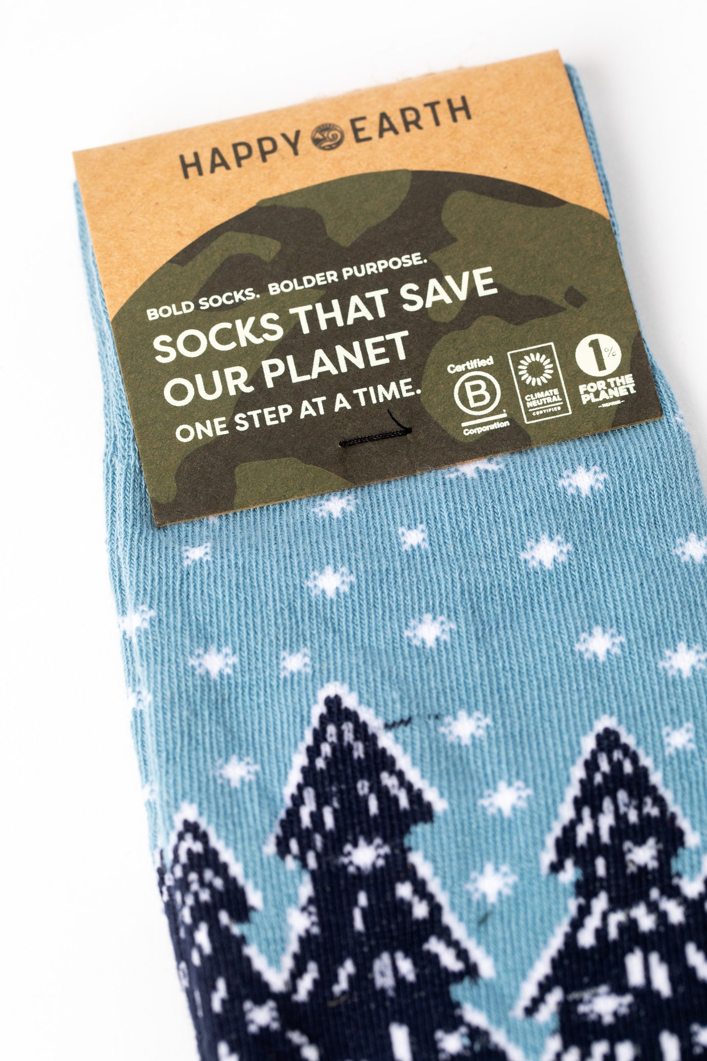 Blue pair of socks with winter wonderland design