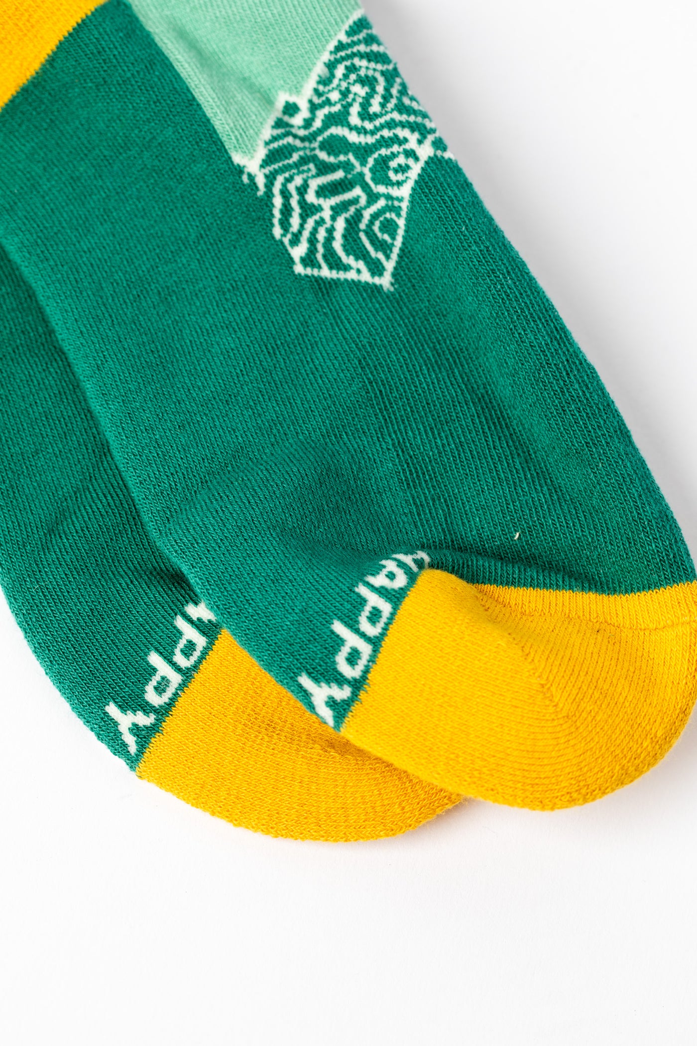Green and yellow multicolor socks with mountain and sun design
