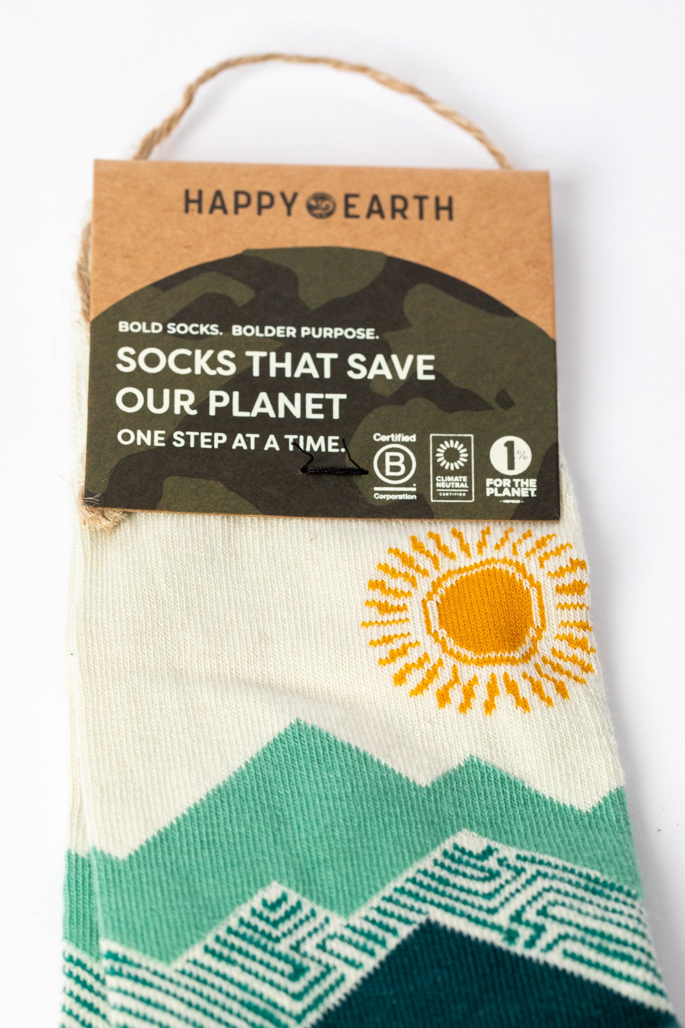 Green and yellow multicolor socks with mountain and sun design