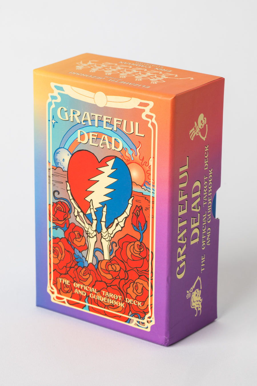 Grateful Dead Tarot Deck with Steal Your Face heart design and roses on colorful rainbow box.