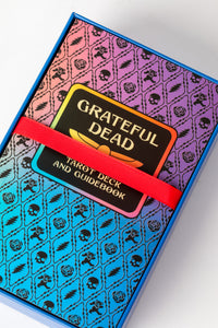 Grateful Dead Tarot guidebook with rainbow skull-and-rose pattern on cover in box.