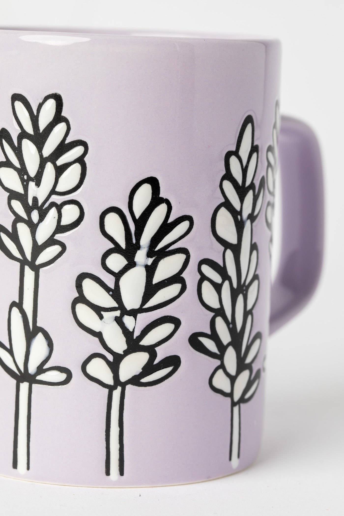 Lavender Mug with floral design and glossy glaze.