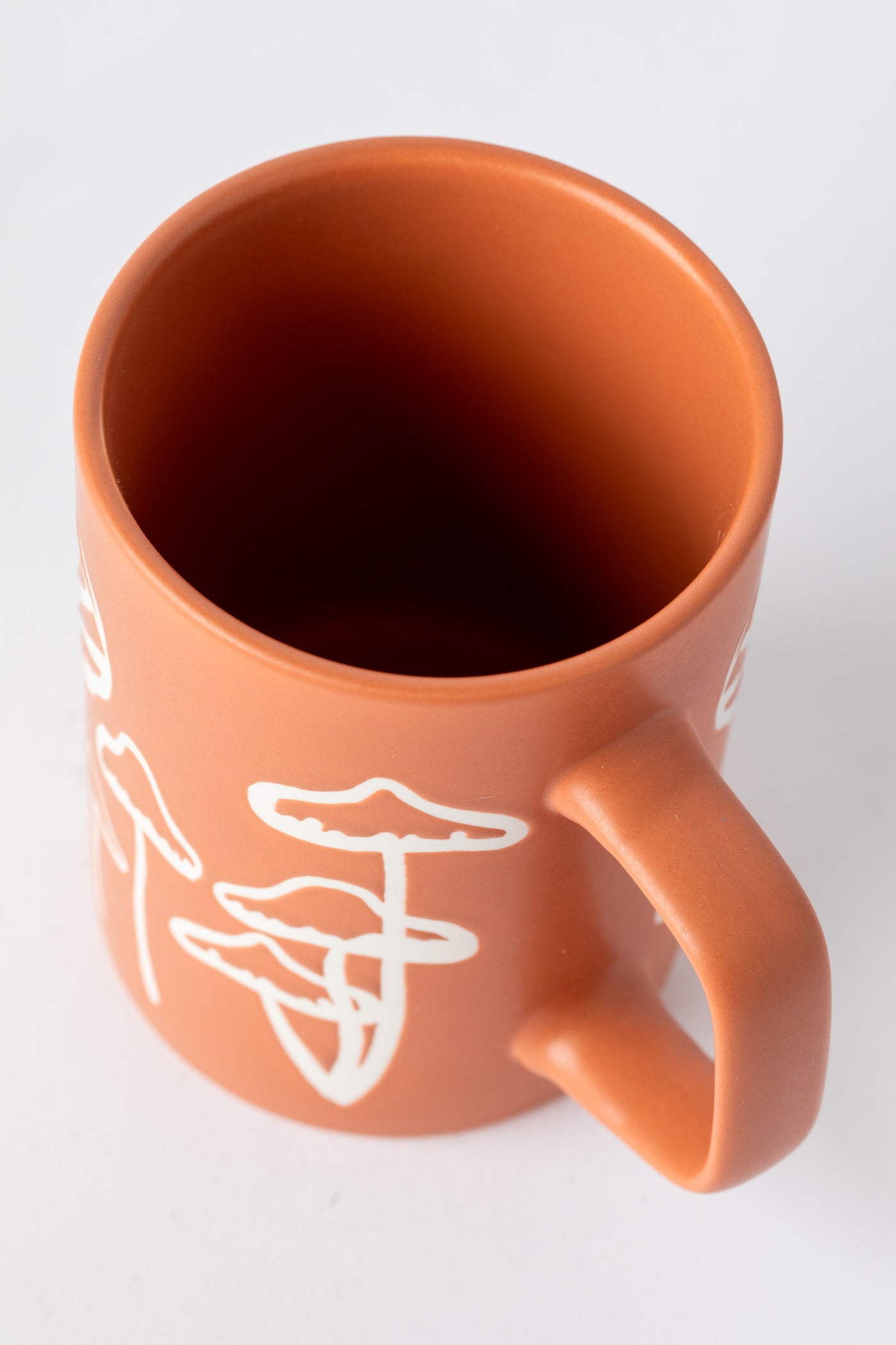 Orange Mushroom Mug with matte finish and hand-drawn mushrooms.
