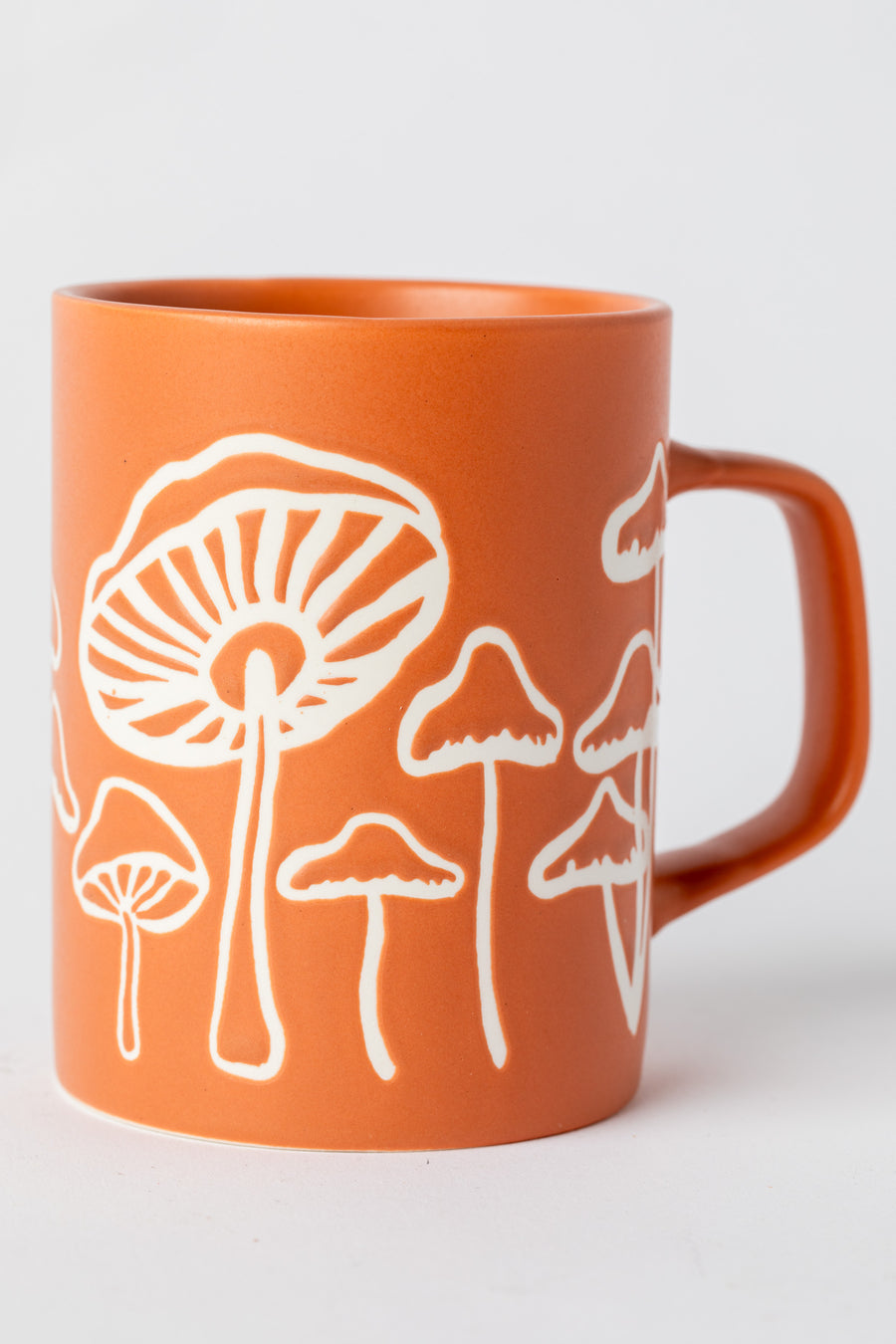 Orange Mushroom Mug with matte finish and hand-drawn mushrooms.