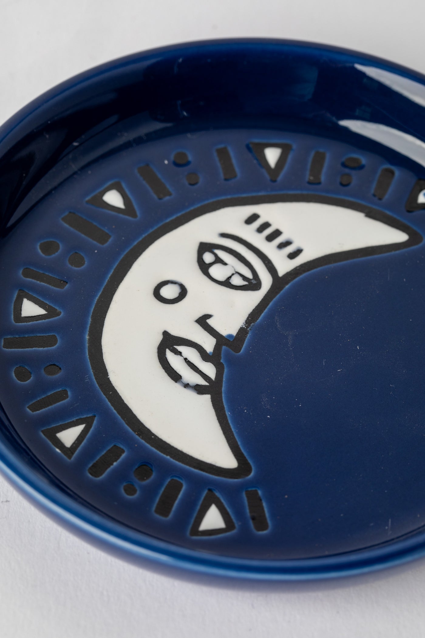 Navy blue ceramic coaster with crescent moon design
