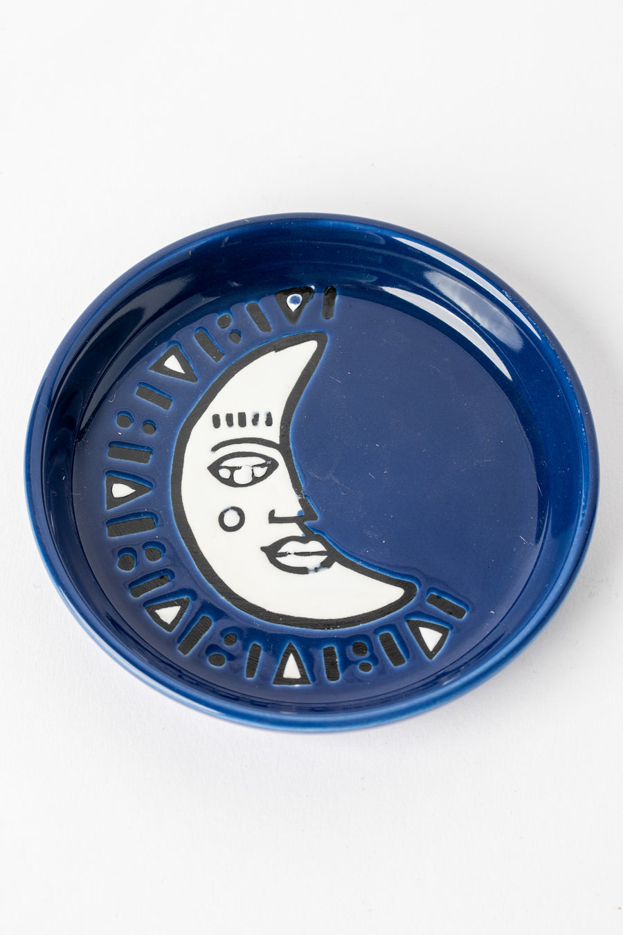 Navy blue ceramic coaster with crescent moon design