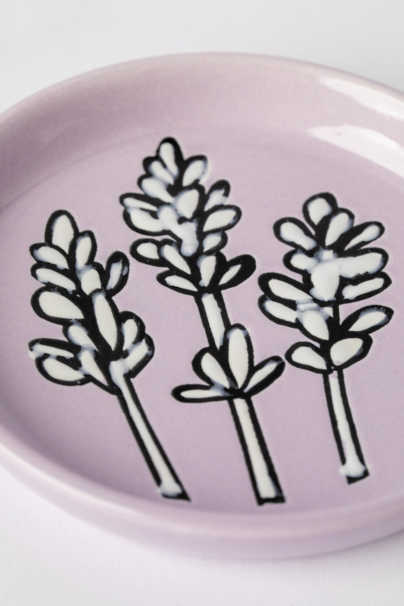 Lavender ceramic coaster with floral design