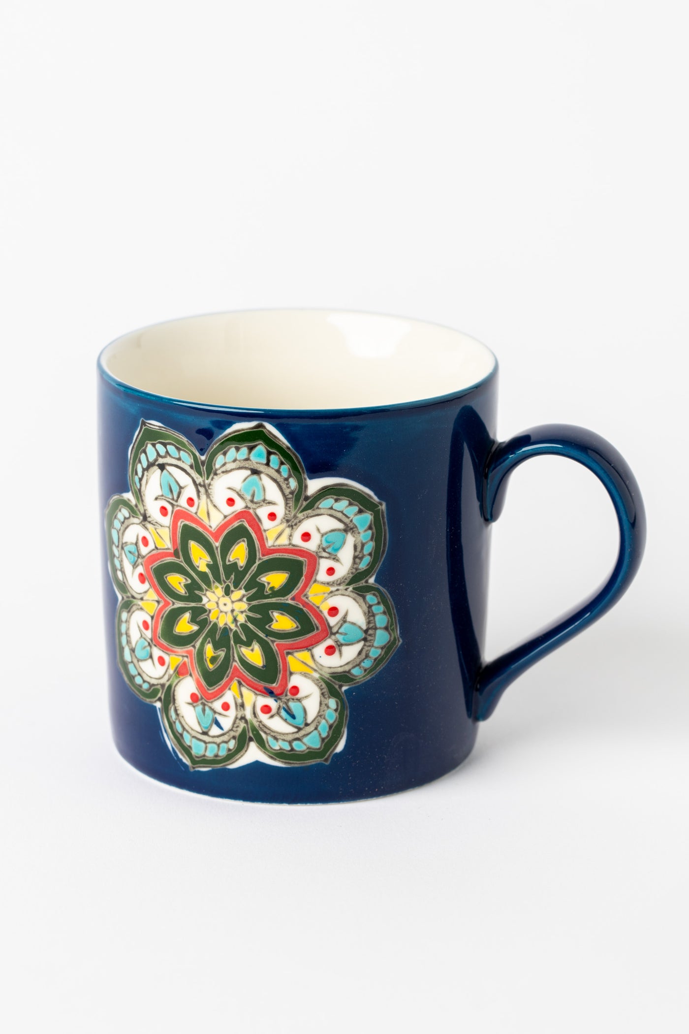 Mandala Mug in blue with embossed floral mandala design.