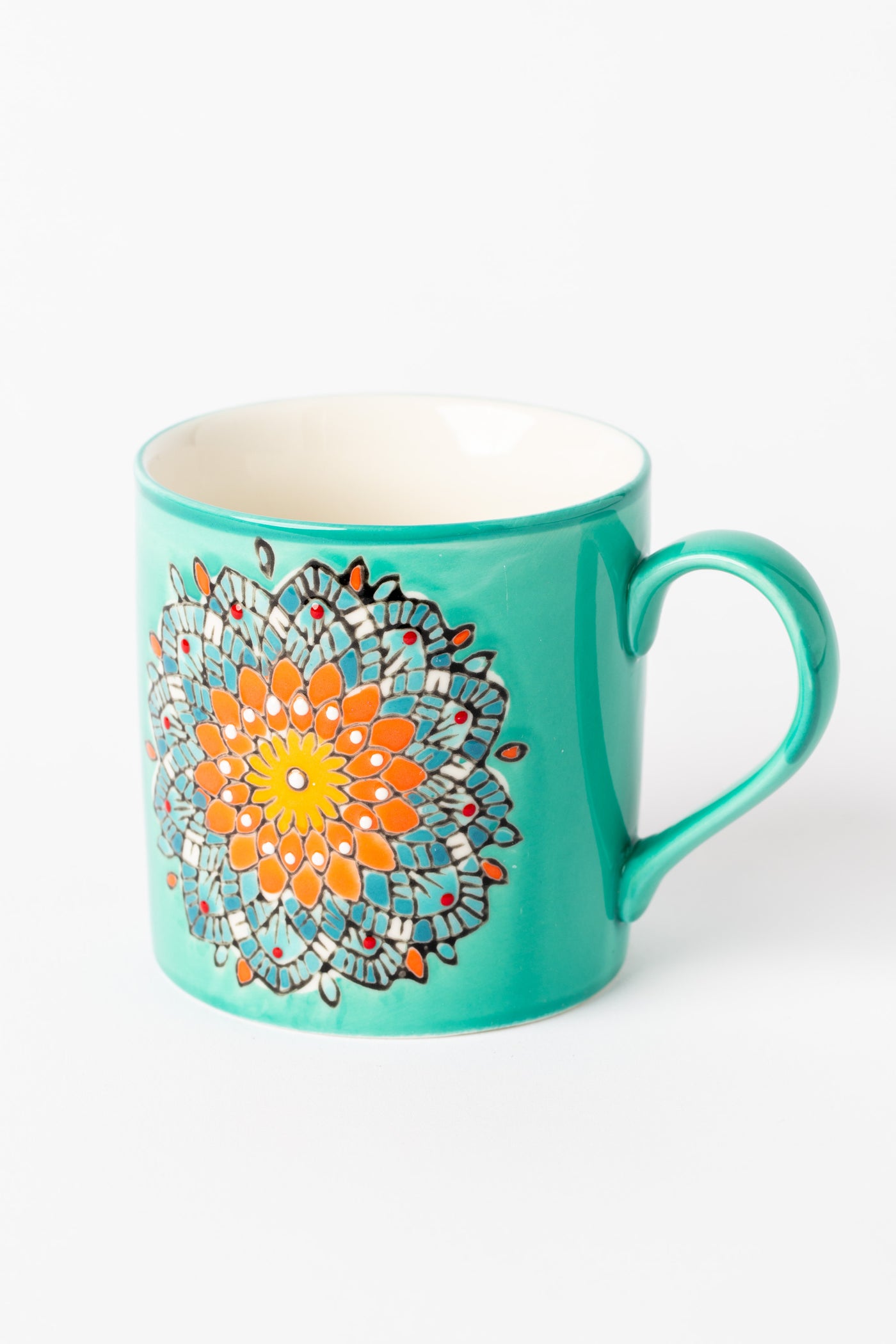 Mandala Mug in turquoise with embossed floral mandala design.
