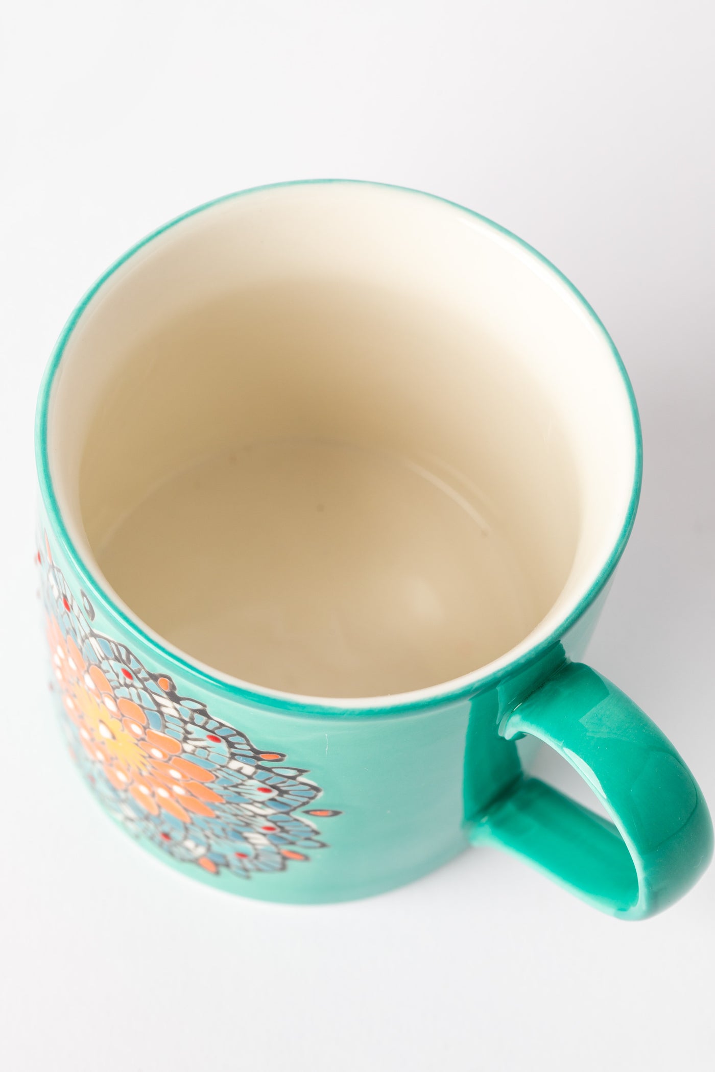 Turquoise Mandala Mug showing interior cream glaze.