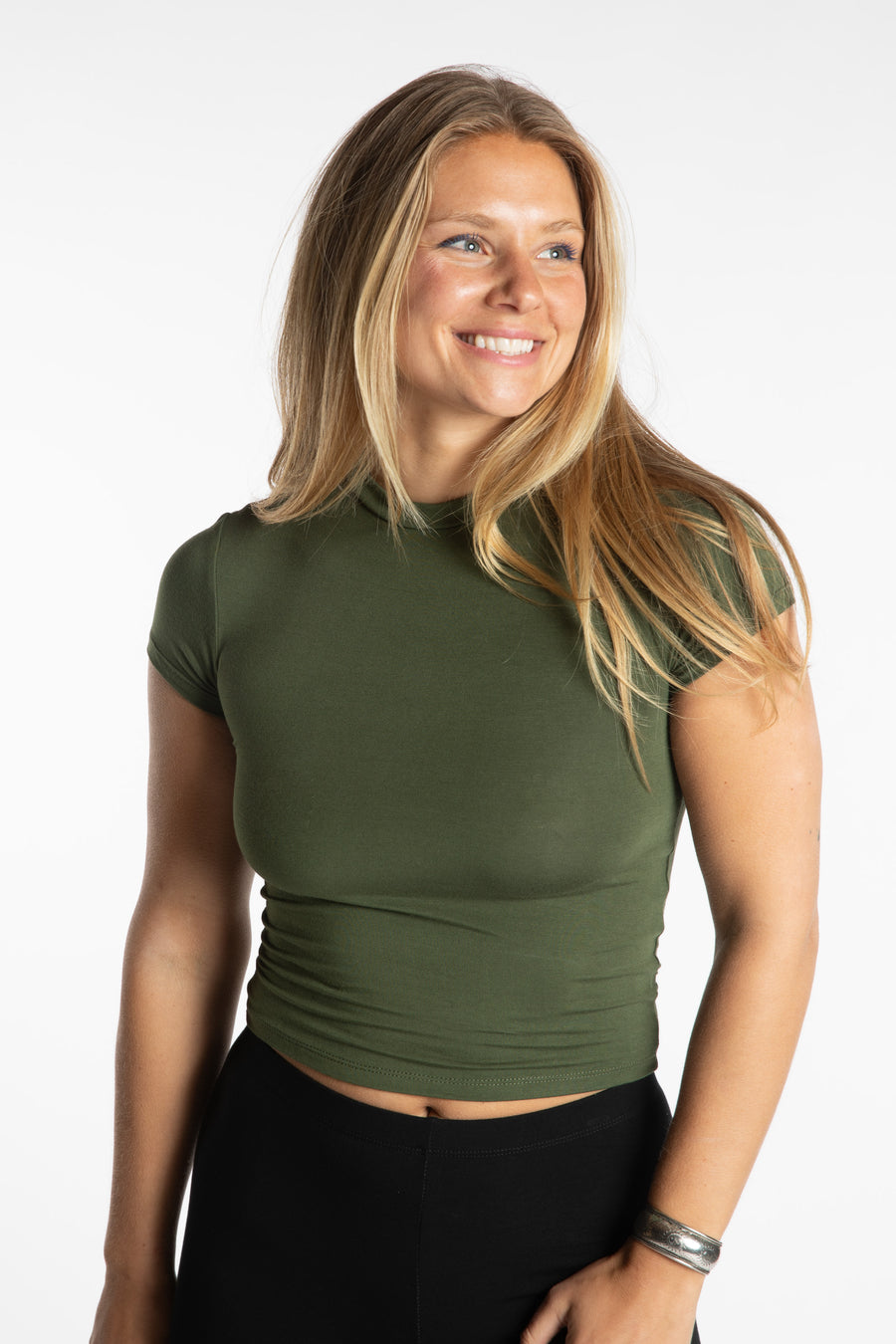 Sophie is wearing the S/M Green Chara Crew Neck Top