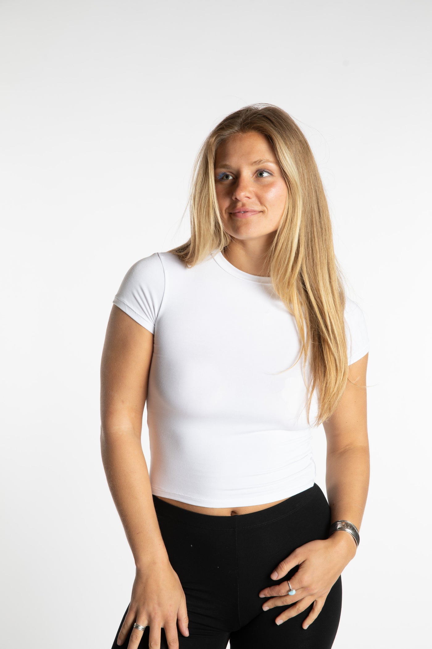 Sophie is wearing the S/M White Chara Crew Neck Top