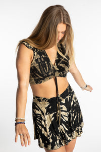 Sophie is wearing the Black and White Tie Dye Cinch Crop Top and Mudmee Tie Dye Skort