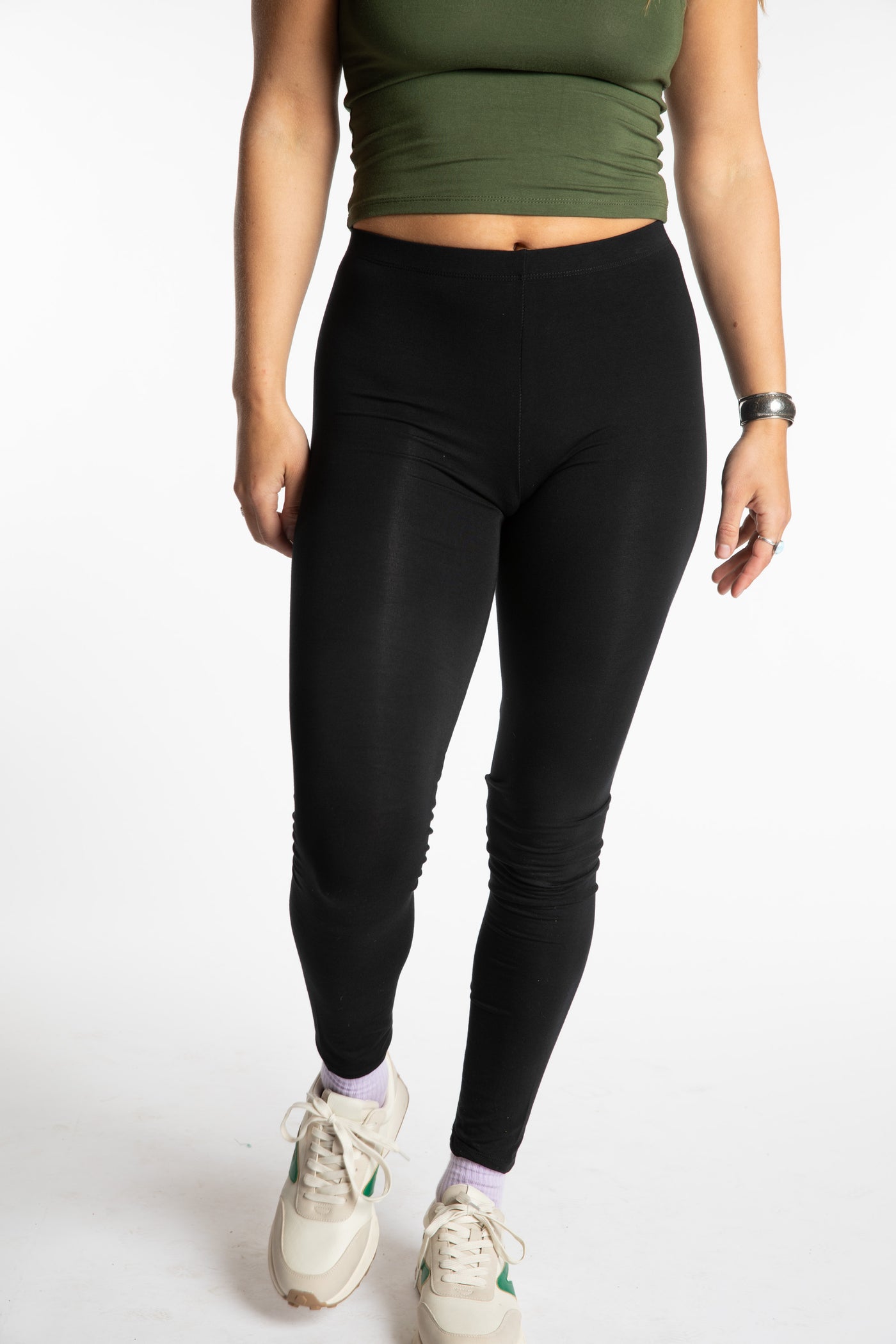 Sophie is wearing the S/M Solid Black Leggings