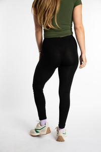 Sophie is wearing the S/M Solid Black Leggings