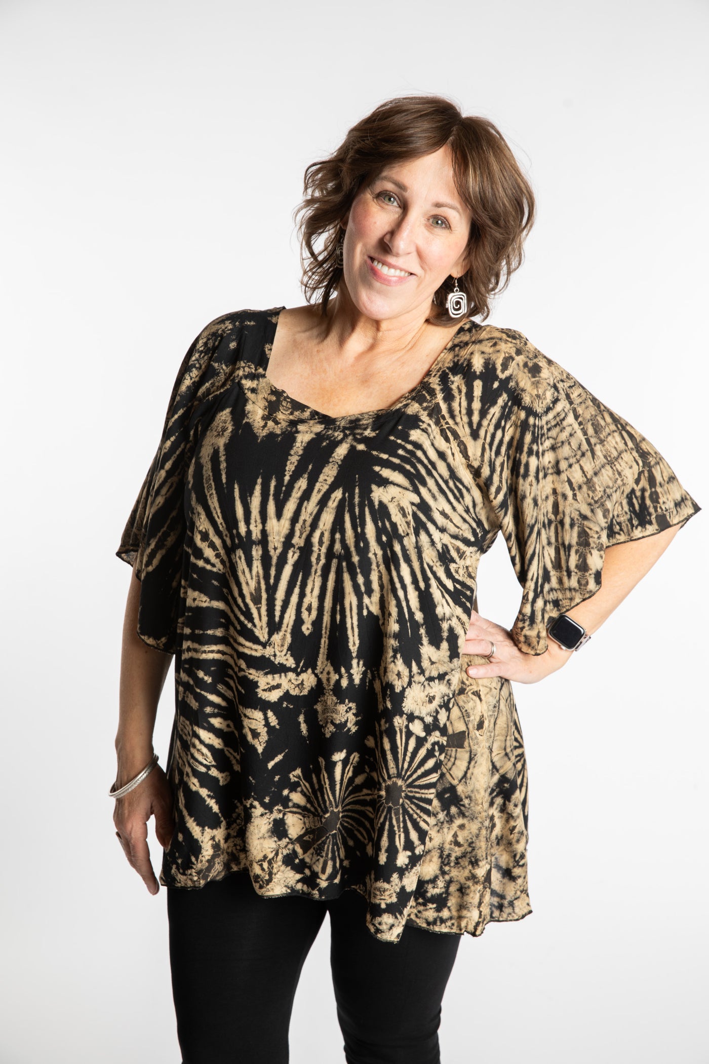 Betty is wearing the Black and White Benya Tie Dye Butterfly Top