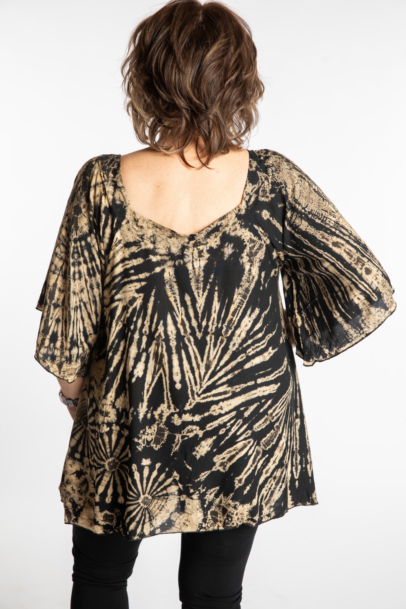 Betty is wearing the Black and White Benya Tie Dye Butterfly Top