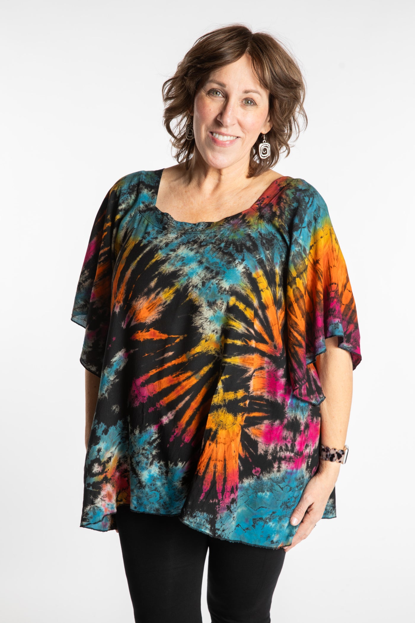 Betty is wearing the Black Rainbow Benya Tie Dye Butterfly Top