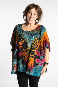 Betty is wearing the Black Rainbow Benya Tie Dye Butterfly Top