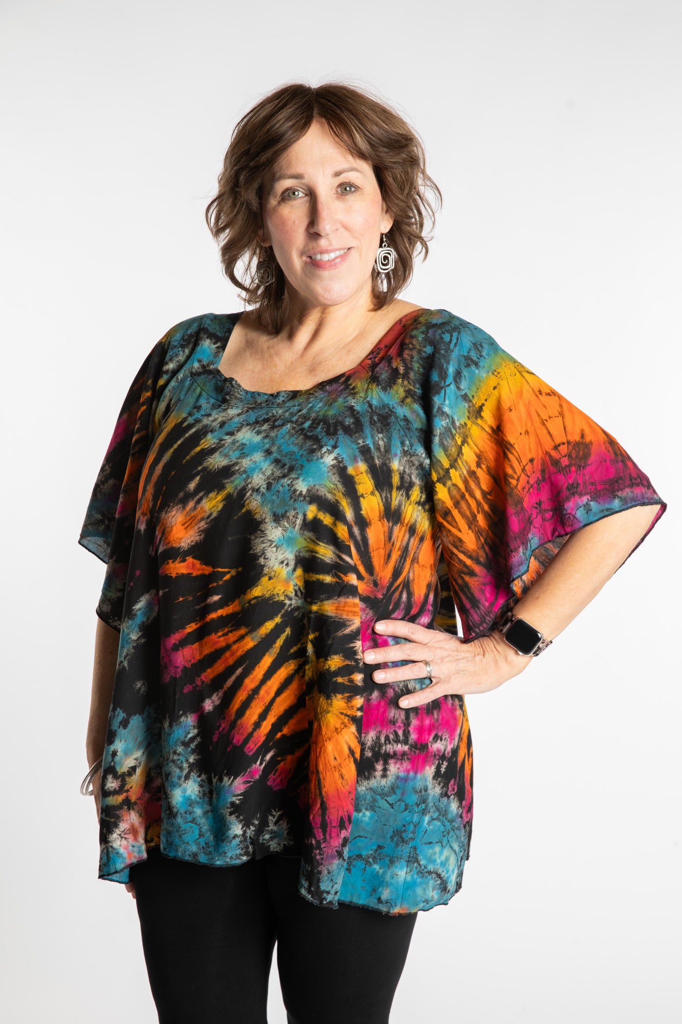 Betty is wearing the Black Rainbow Benya Tie Dye Butterfly Top