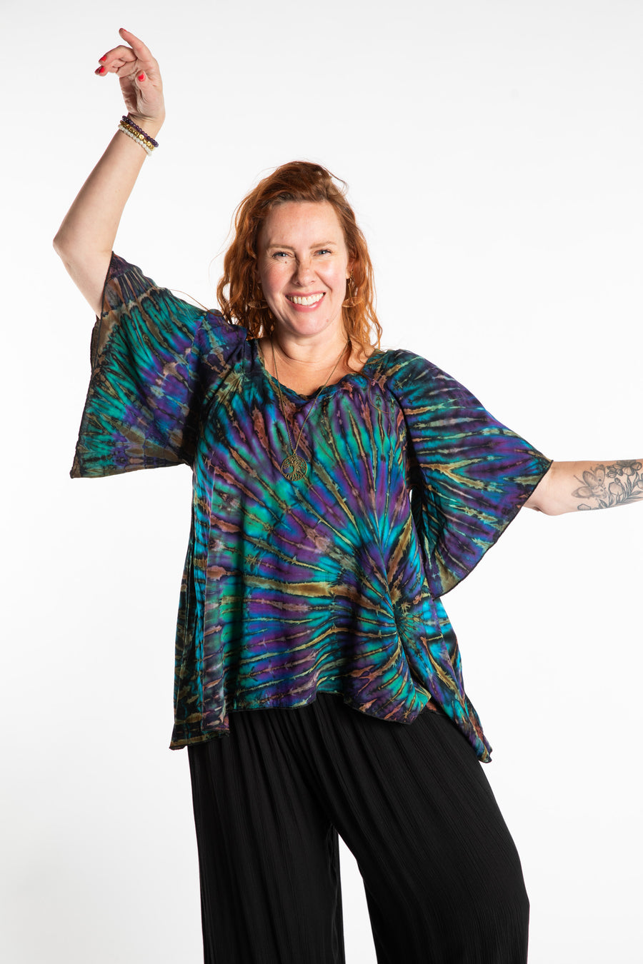 Maggie is wearing the Blue Ocean Benya Tie Dye Butterfly Top