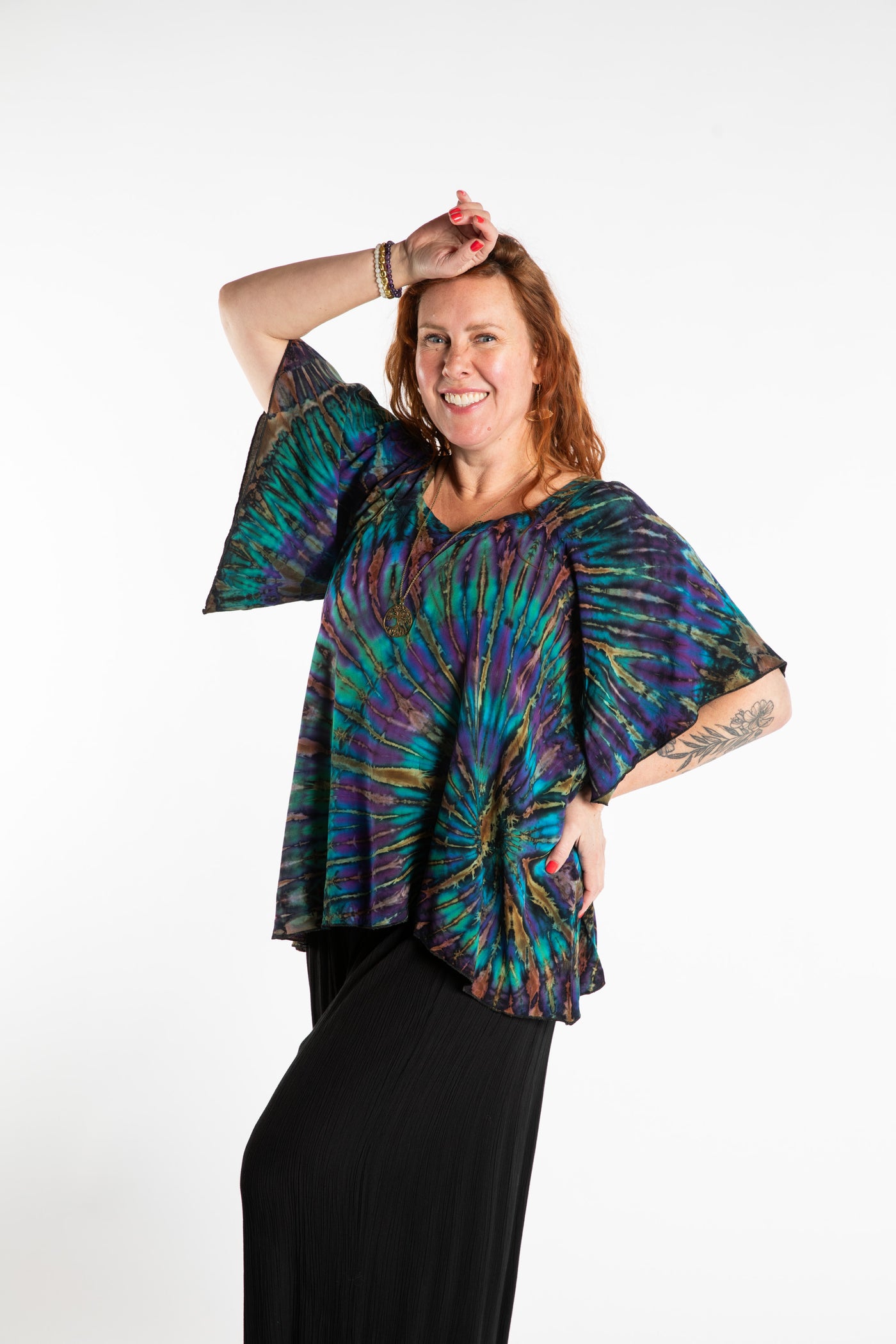 Maggie is wearing the Blue Ocean Benya Tie Dye Butterfly Top