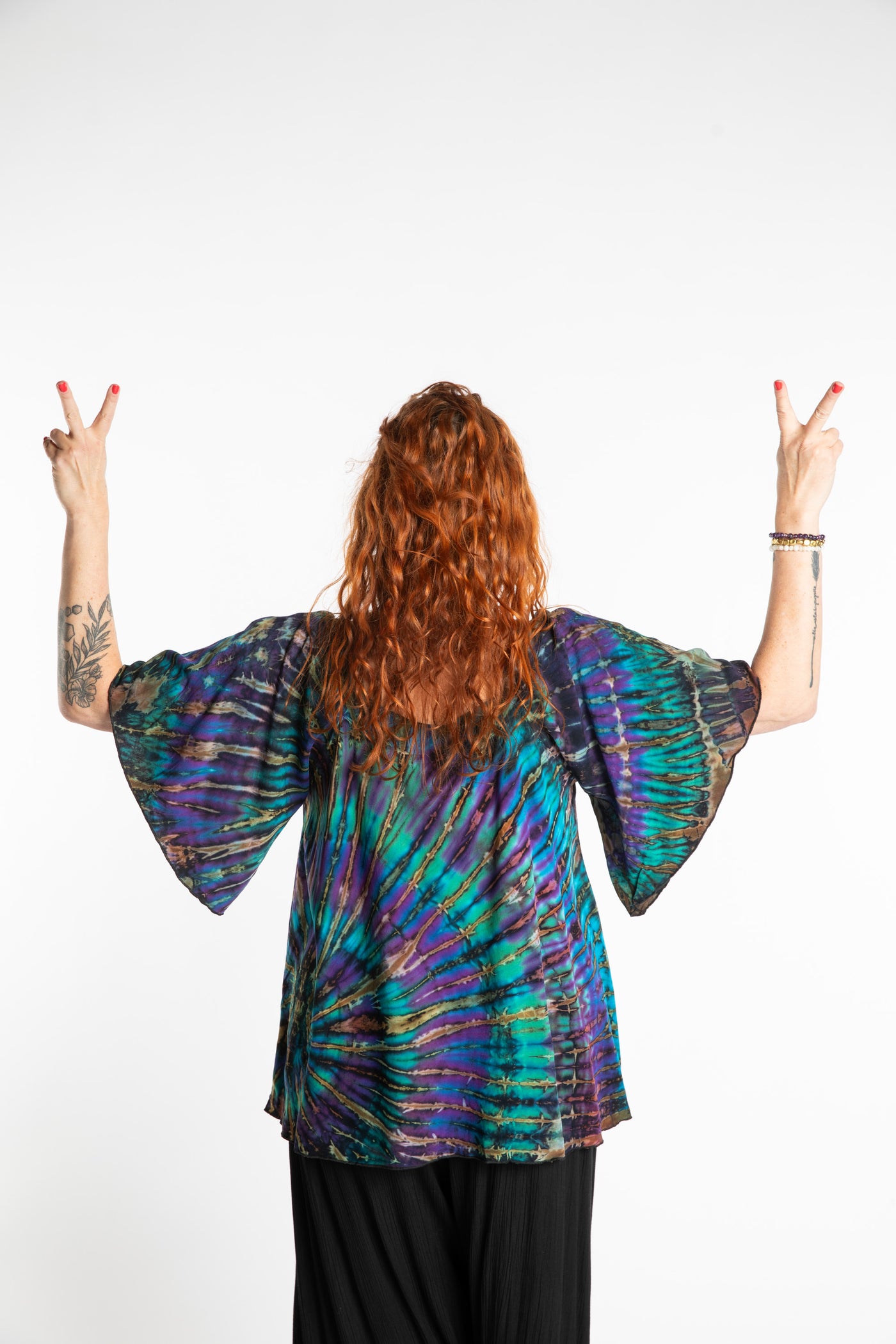 Maggie is wearing the Blue Ocean Benya Tie Dye Butterfly Top