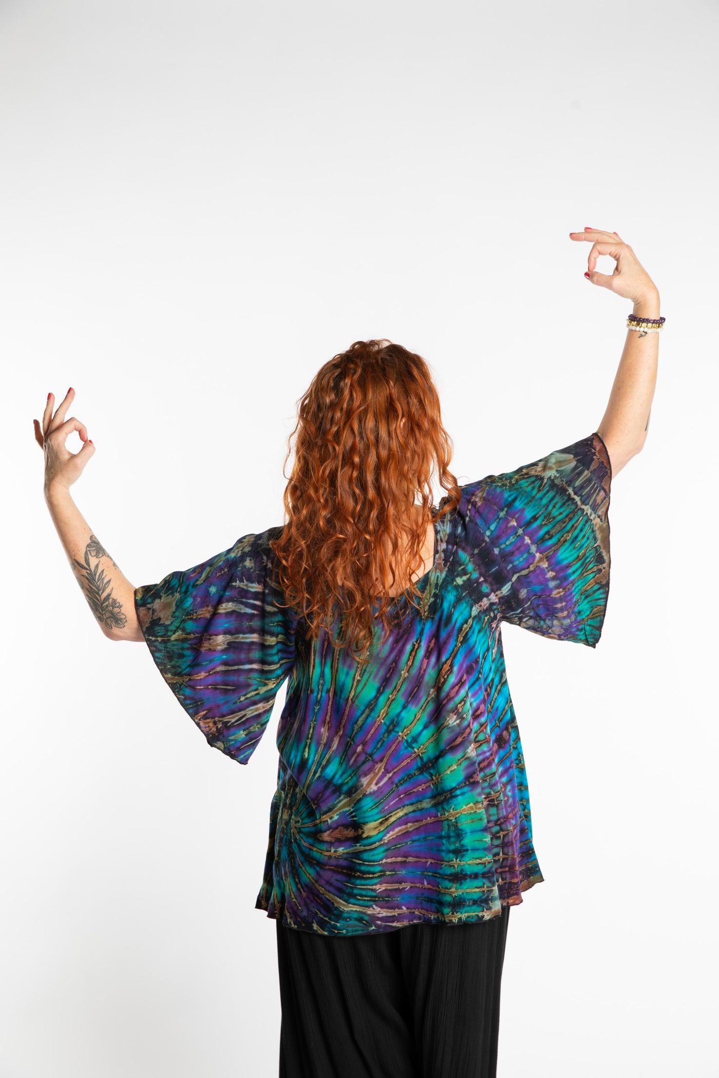 Maggie is wearing the Blue Ocean Benya Tie Dye Butterfly Top
