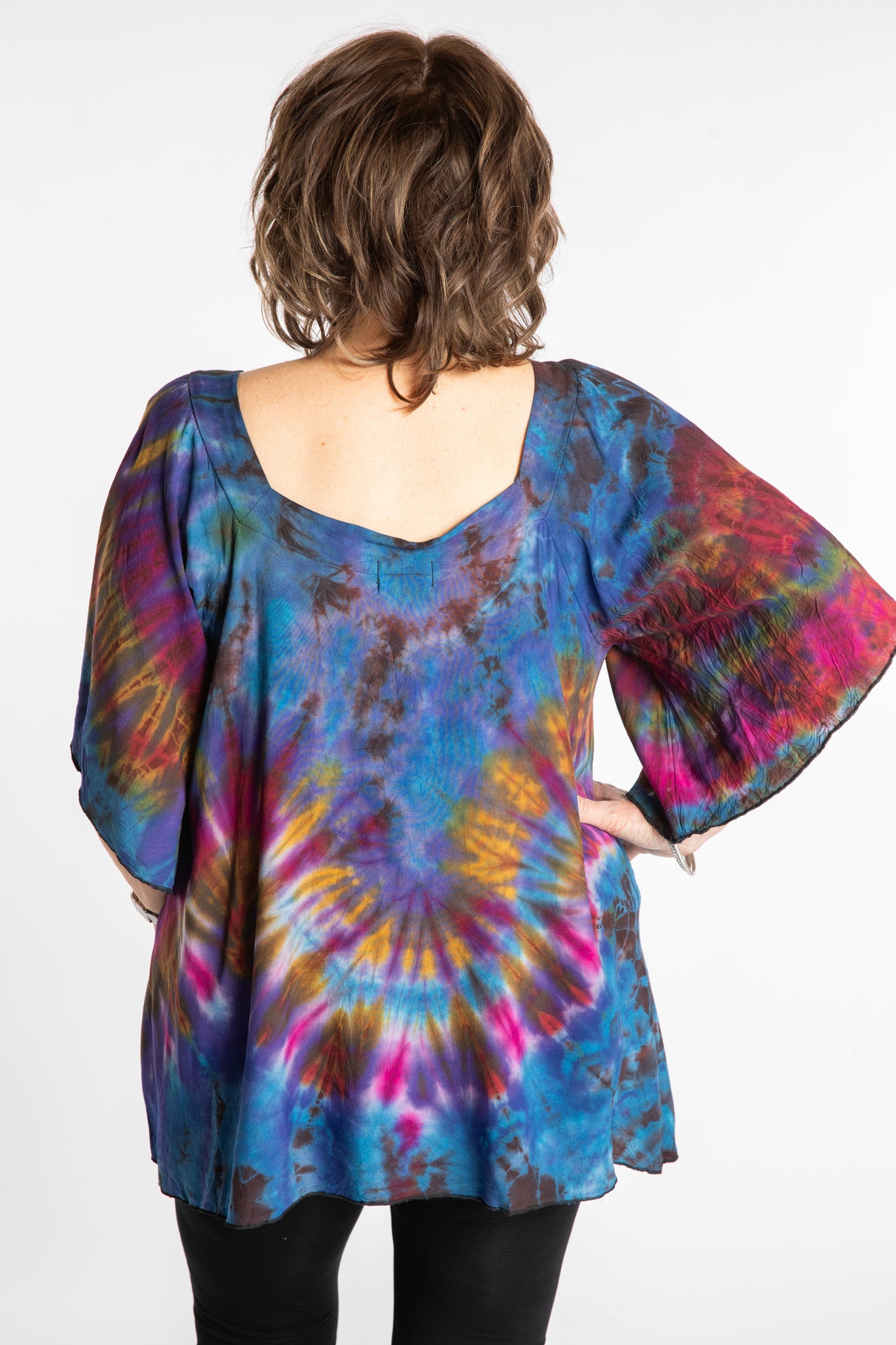 Betty is wearing the Purple Benya Tie Dye Butterfly Top